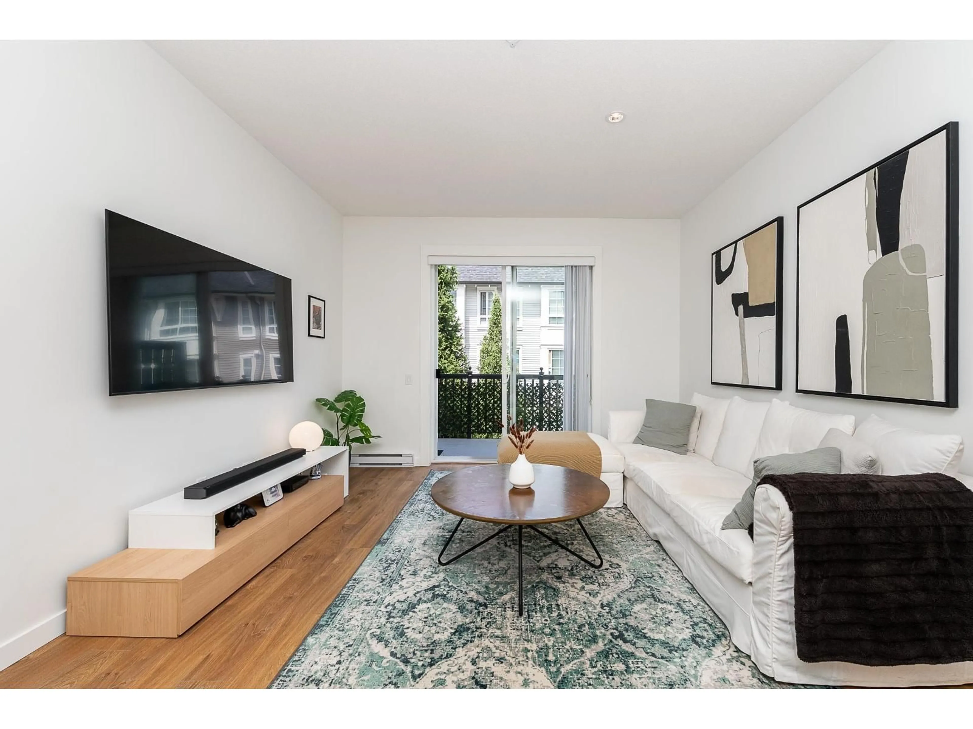 Living room with furniture, wood/laminate floor for 59 - 8476 207A STREET, Langley British Columbia V2Y0S6