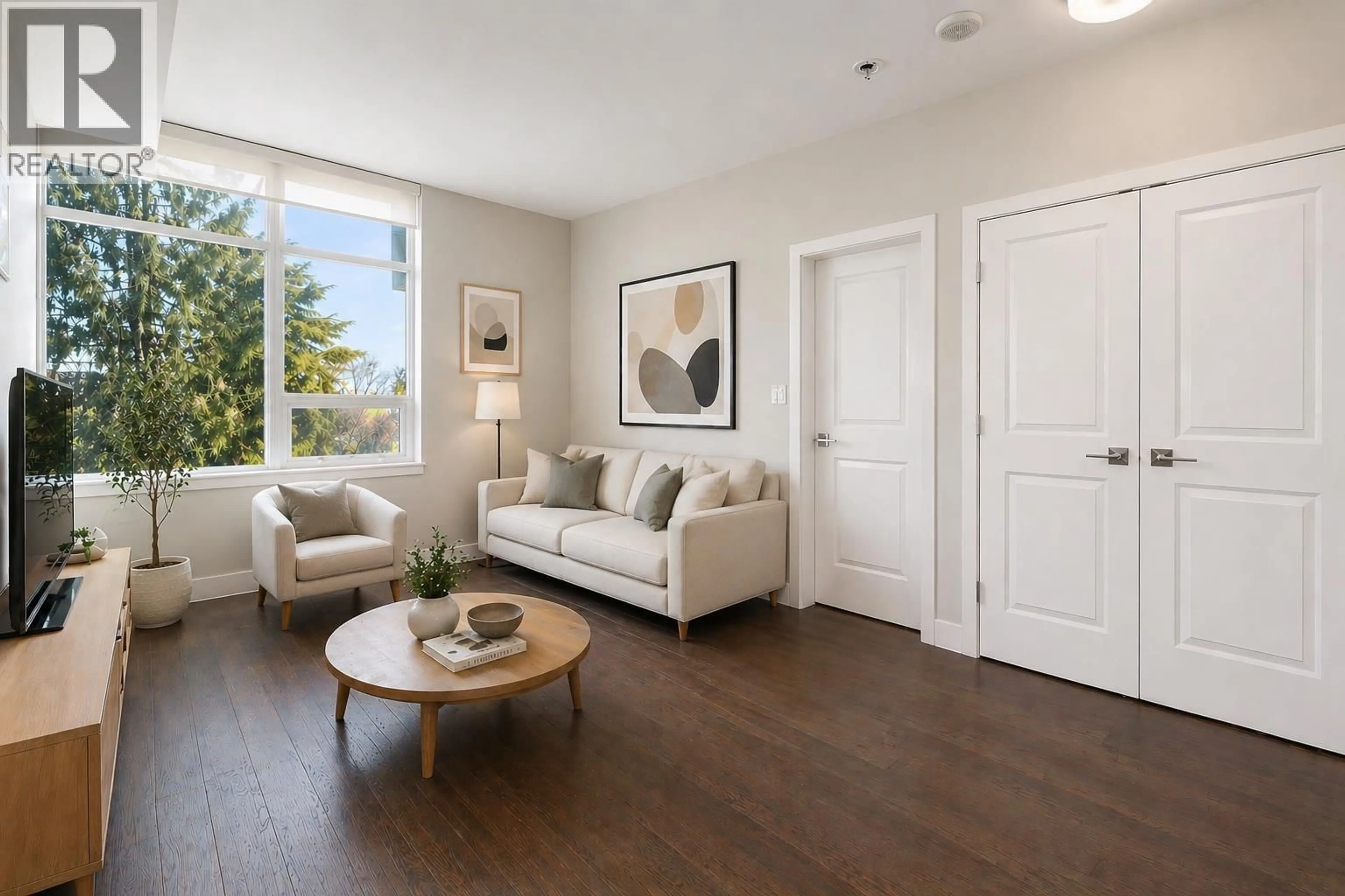 Living room with furniture, wood/laminate floor for 205 - 6383 CAMBIE STREET, Vancouver British Columbia V5Z3B2
