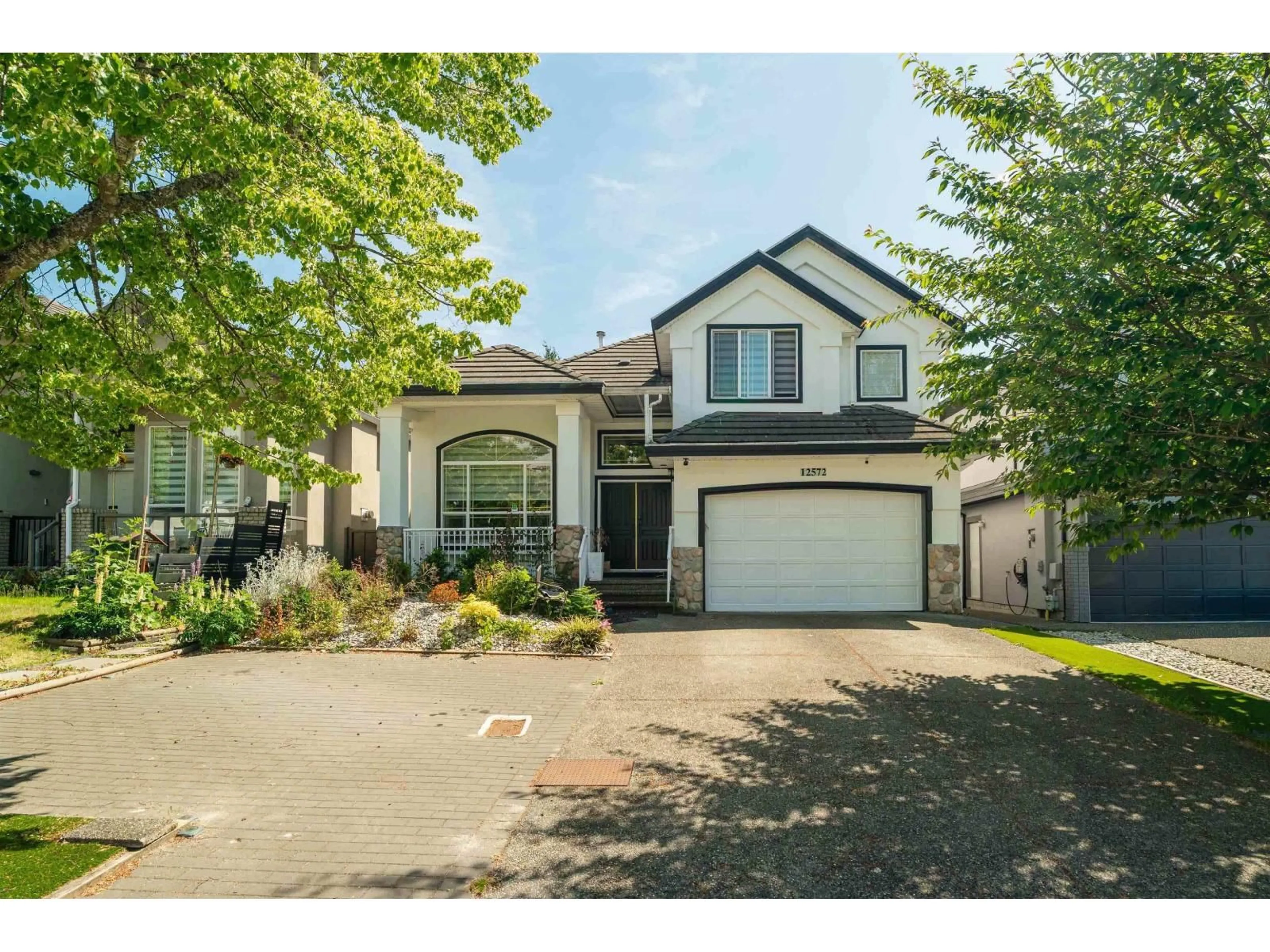 Home with vinyl exterior material, street for 12572 62B AVENUE, Surrey British Columbia V3X3M9