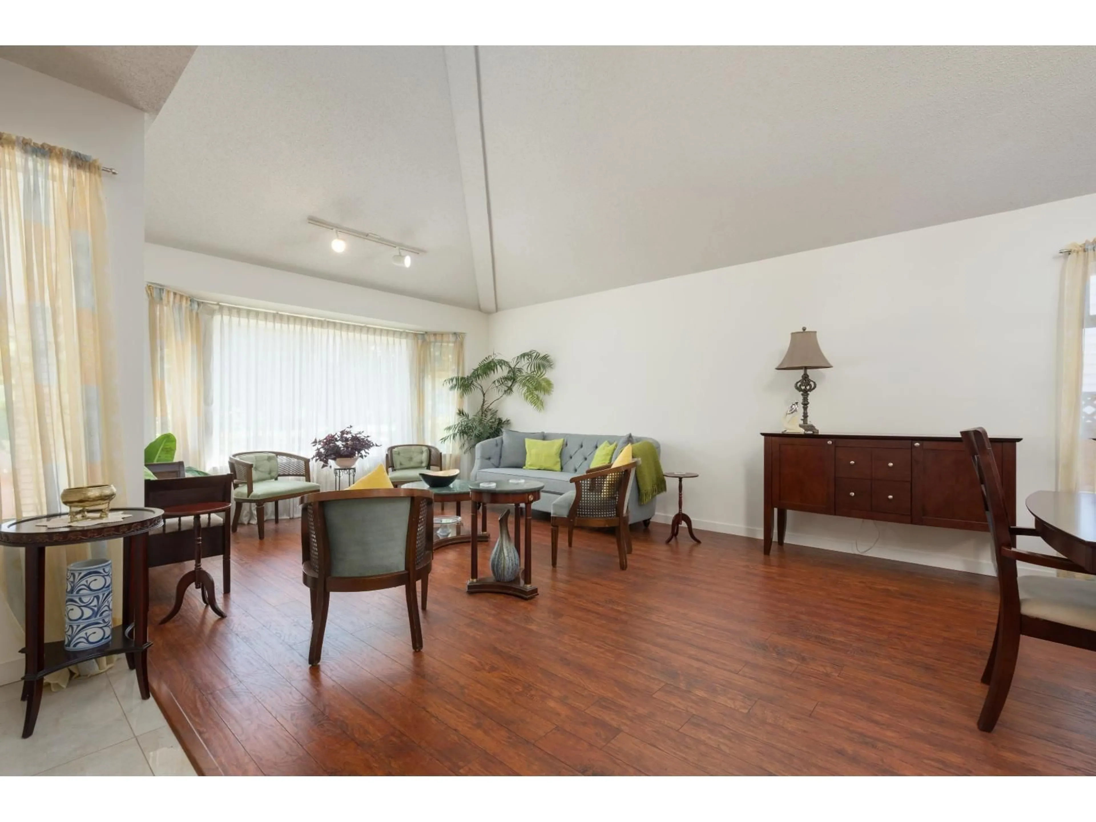 Living room with furniture, wood/laminate floor for 15753 98 AVENUE, Surrey British Columbia V4N2V5