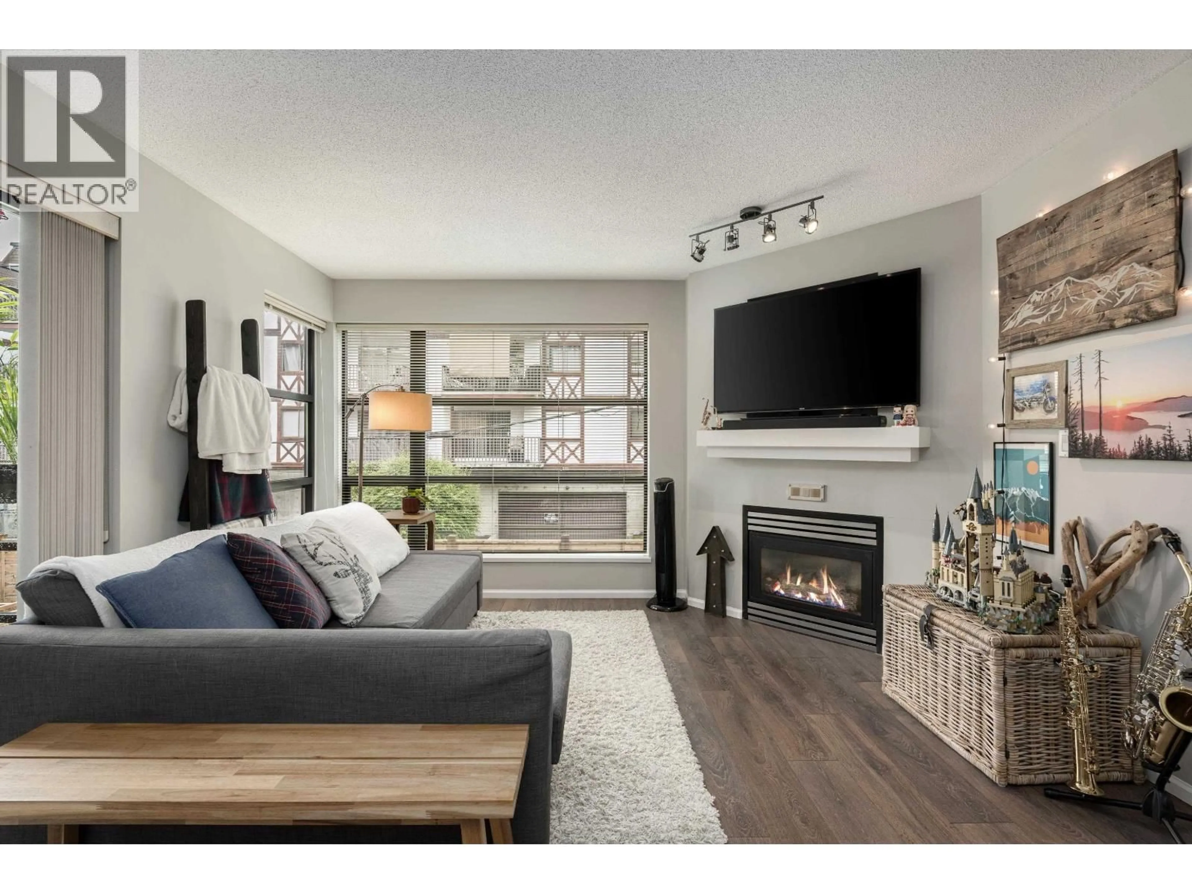 Living room with furniture, wood/laminate floor for 305 - 124 3RD STREET, North Vancouver British Columbia V7M1E8