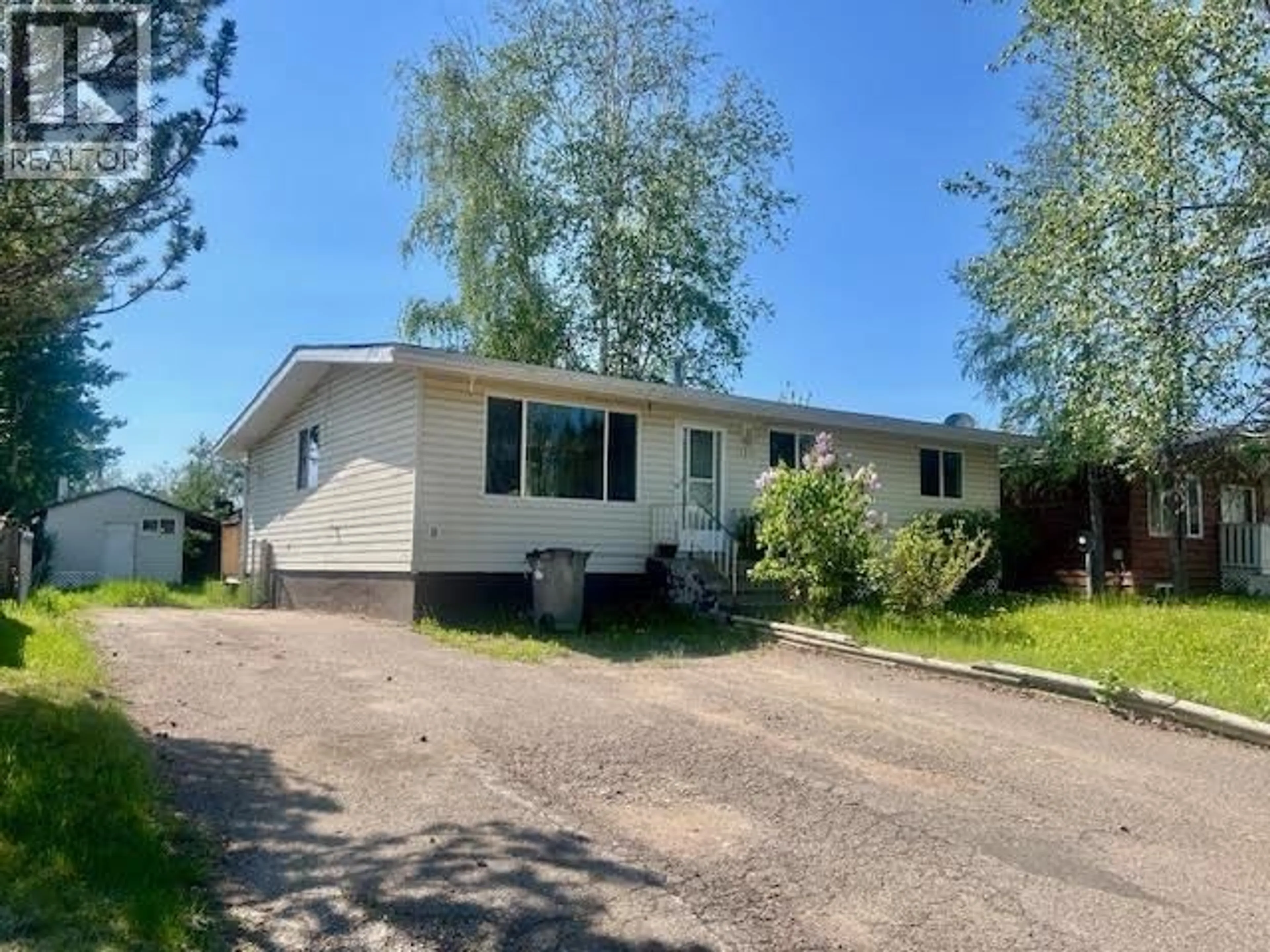 Home with vinyl exterior material, street for 5315 TAMARACK CRESCENT, Fort Nelson British Columbia V0C1R0