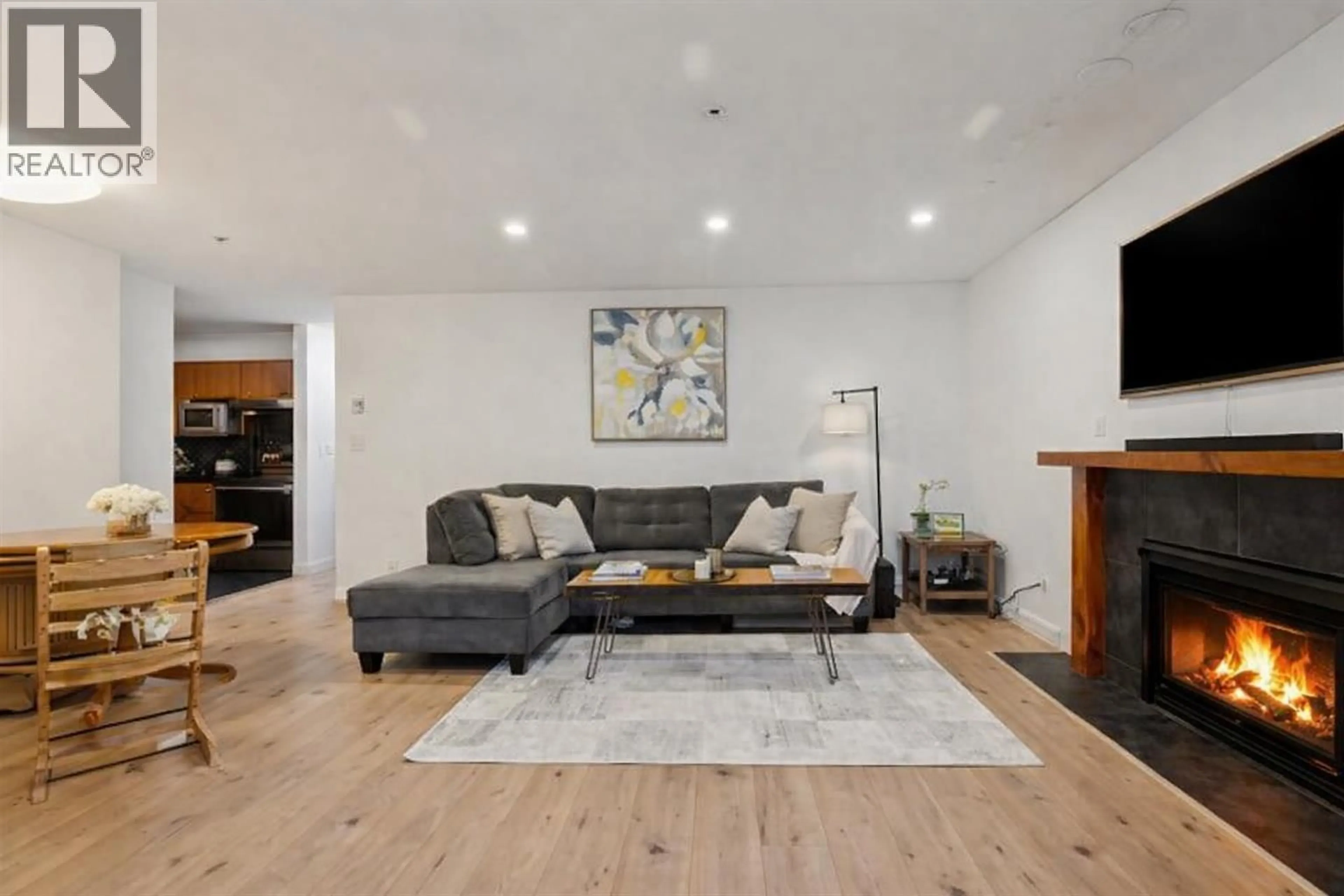 Living room with furniture, wood/laminate floor for 102 - 1689 4TH AVENUE, Vancouver British Columbia V5N1J7