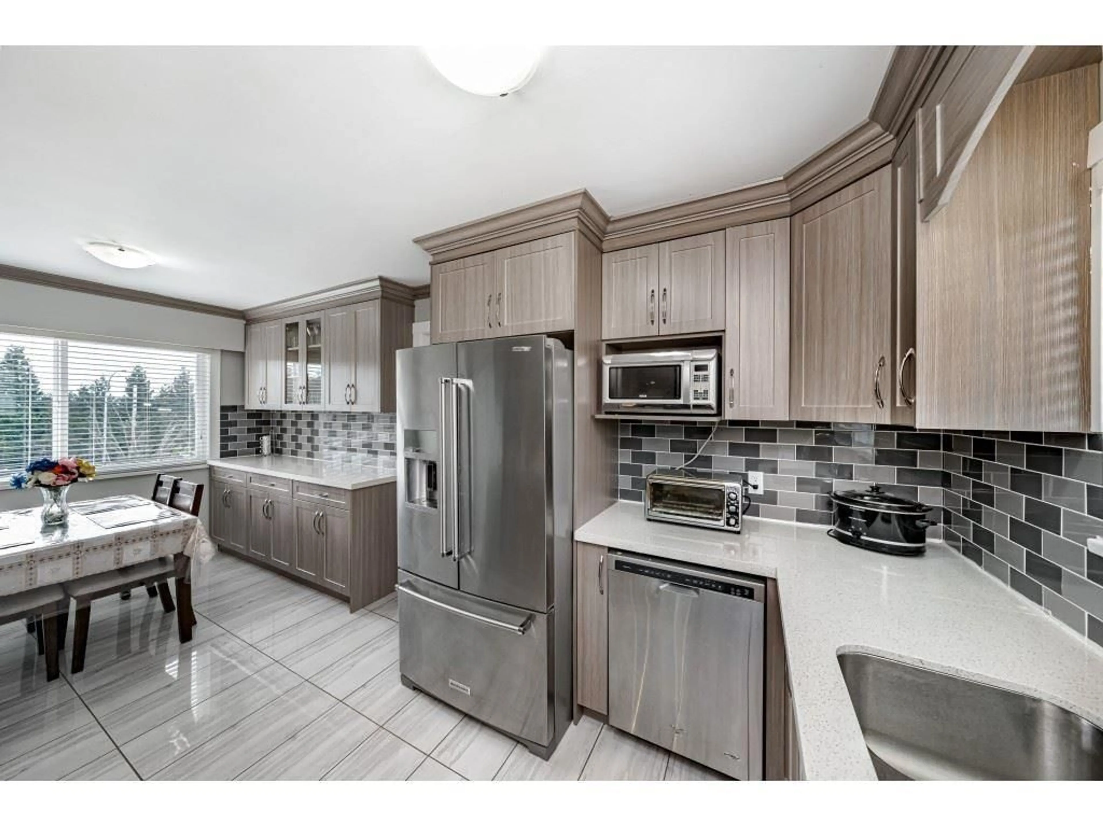 Open concept kitchen, ceramic/tile floor for 18463 56 AVENUE, Surrey British Columbia V3S8J3