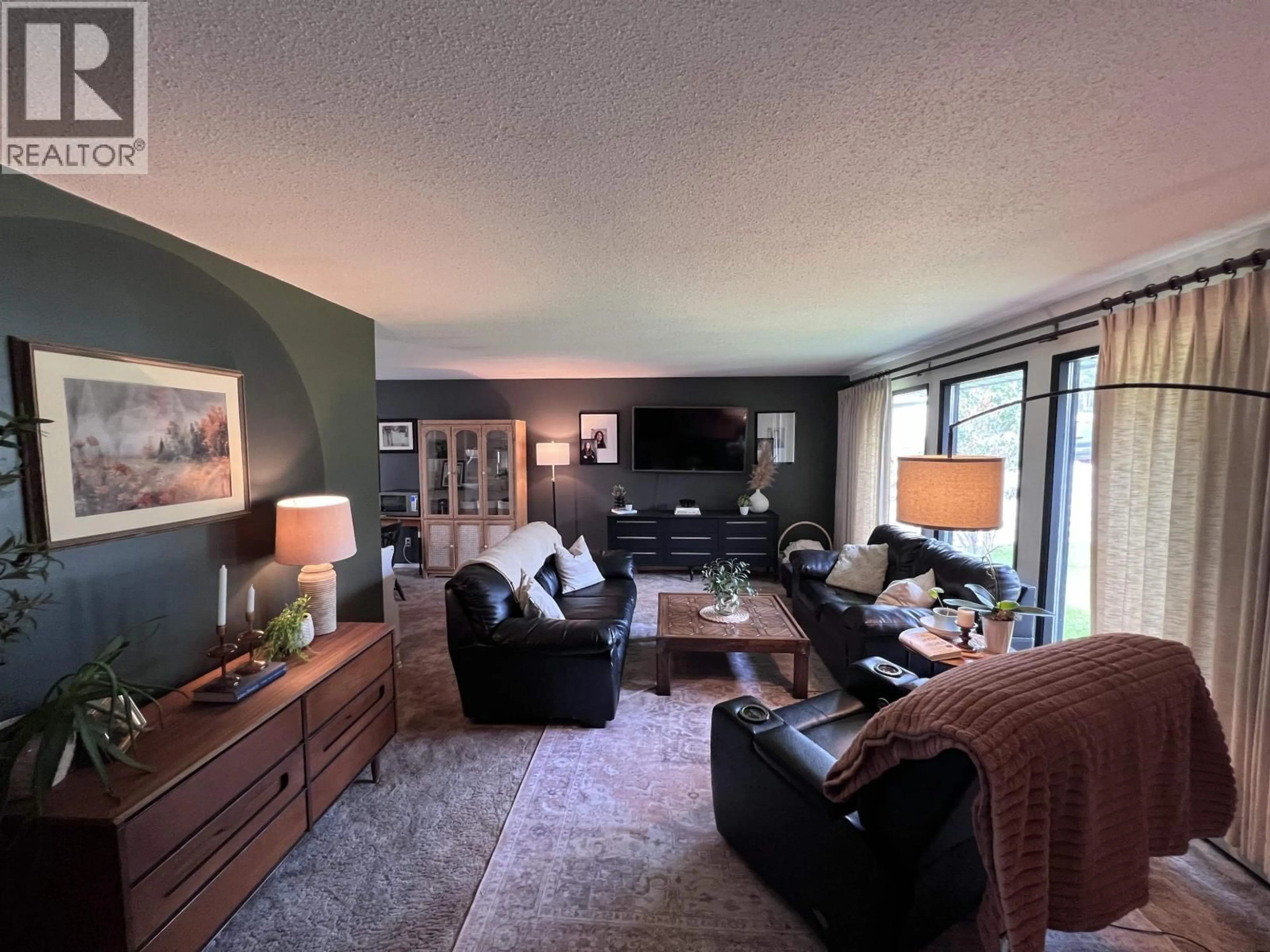 Living room with furniture, unknown for 5415 53 AVENUE, Fort Nelson British Columbia V0C1R0