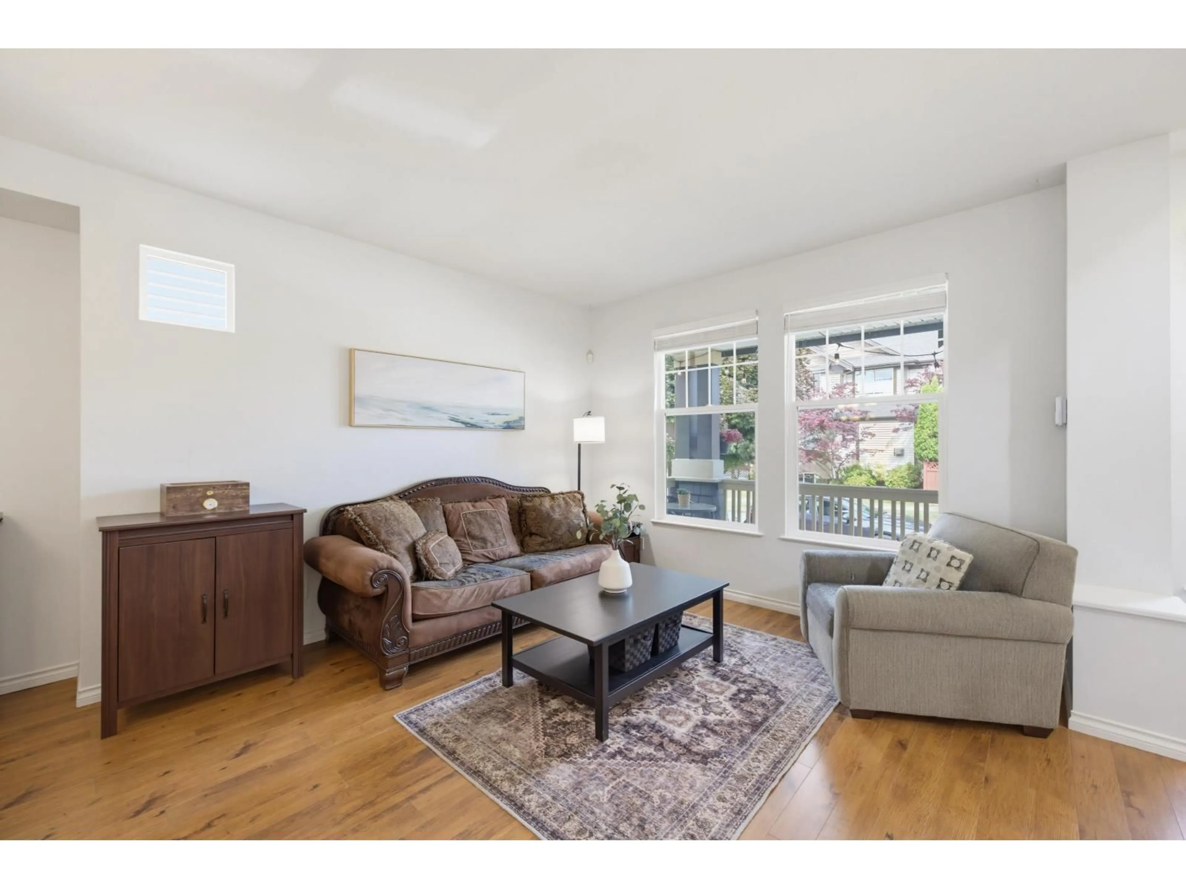 Living room with furniture, wood/laminate floor for 6725 184A STREET, Surrey British Columbia V3S9A8