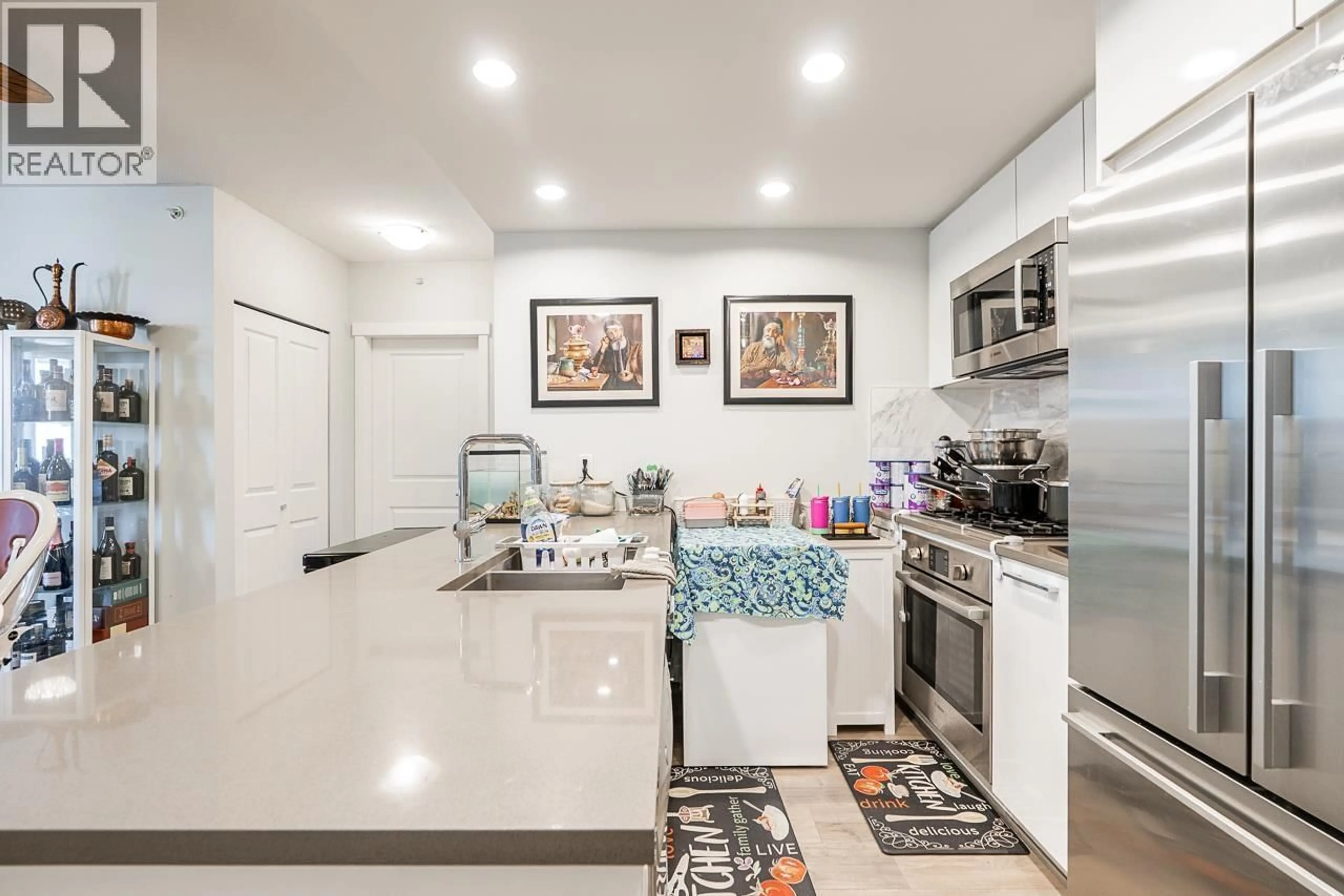 Open concept kitchen, ceramic/tile floor for 1006 - 3281 KENT AVENUE NORTH, Vancouver British Columbia V5S0C4