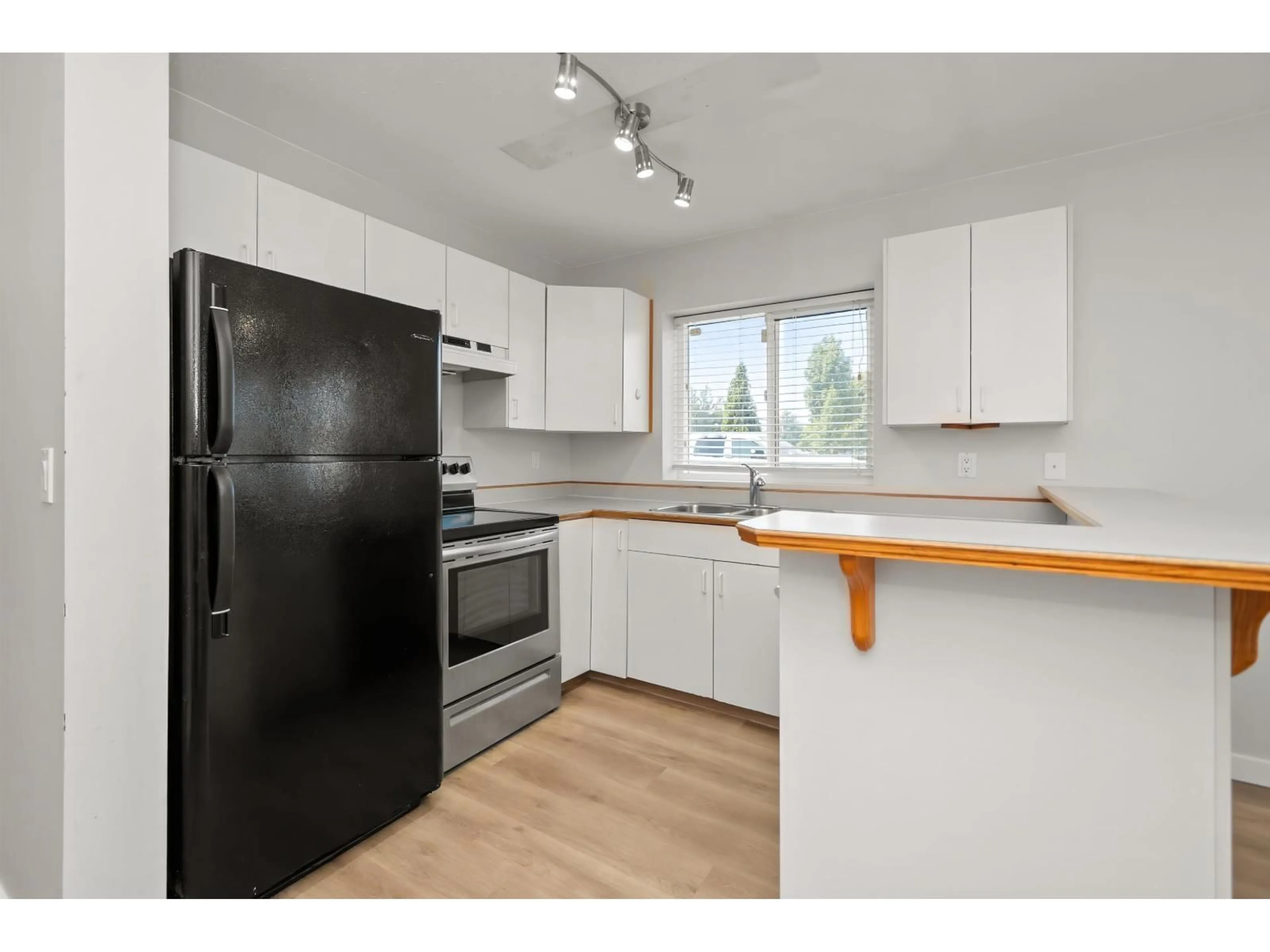 Standard kitchen, wood/laminate floor for 1 - 9206 CORBOULD STREET, Chilliwack British Columbia V2P4A5