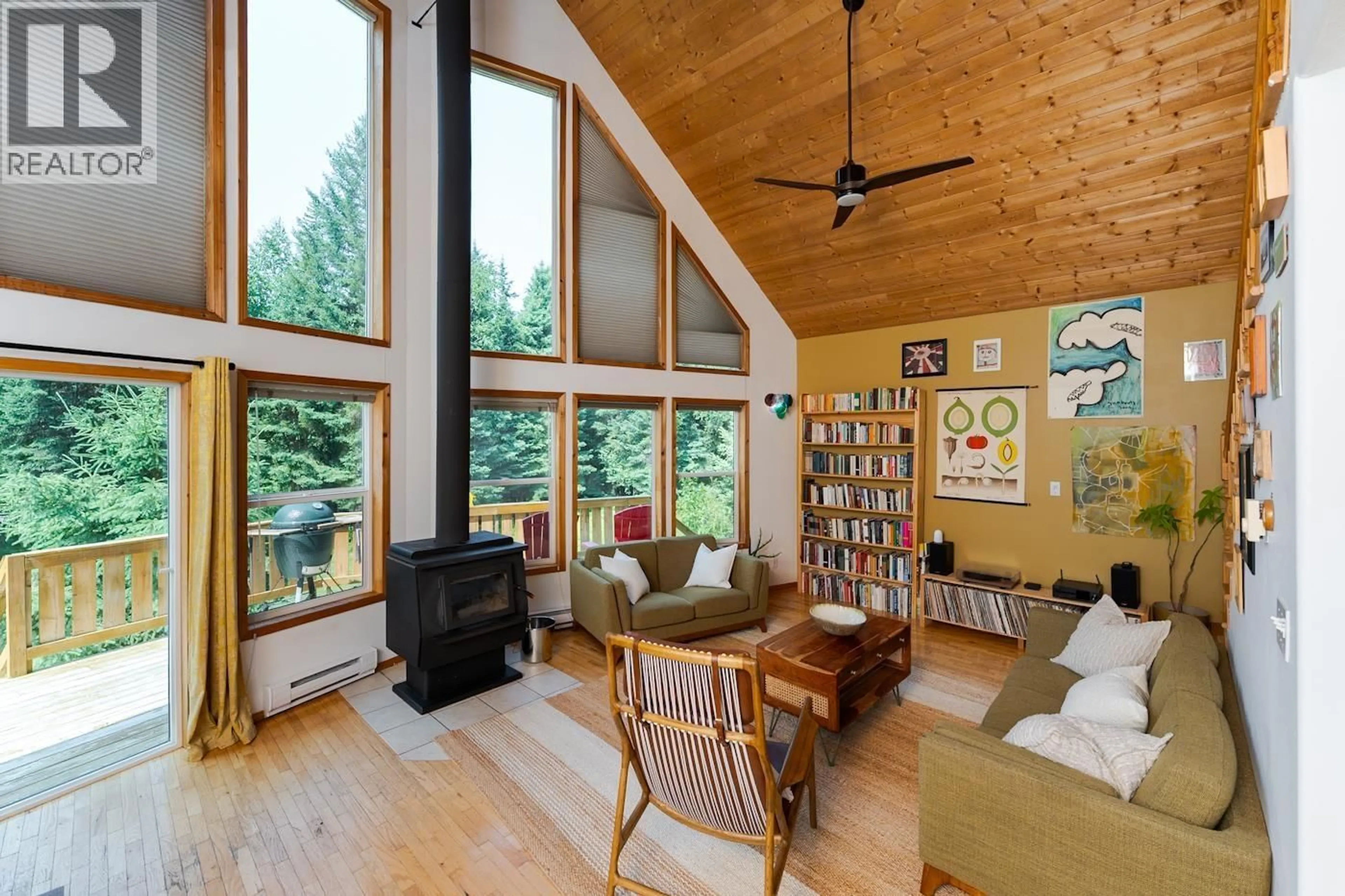 Living room with furniture, wood/laminate floor for 10050 ALPINE DRIVE, Prince George British Columbia V2N5W7