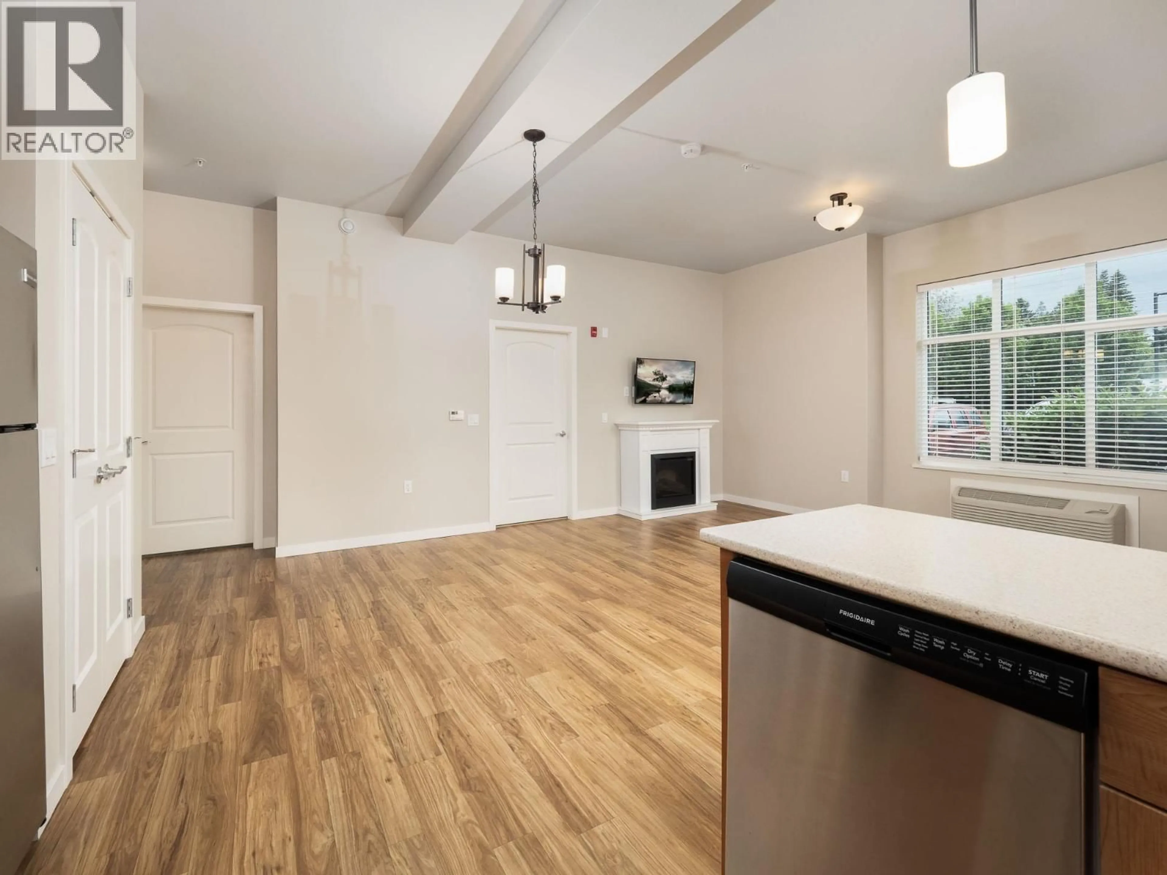 Open concept kitchen, wood/laminate floor for 105 - 1444 20TH AVENUE, Prince George British Columbia V2L0C9