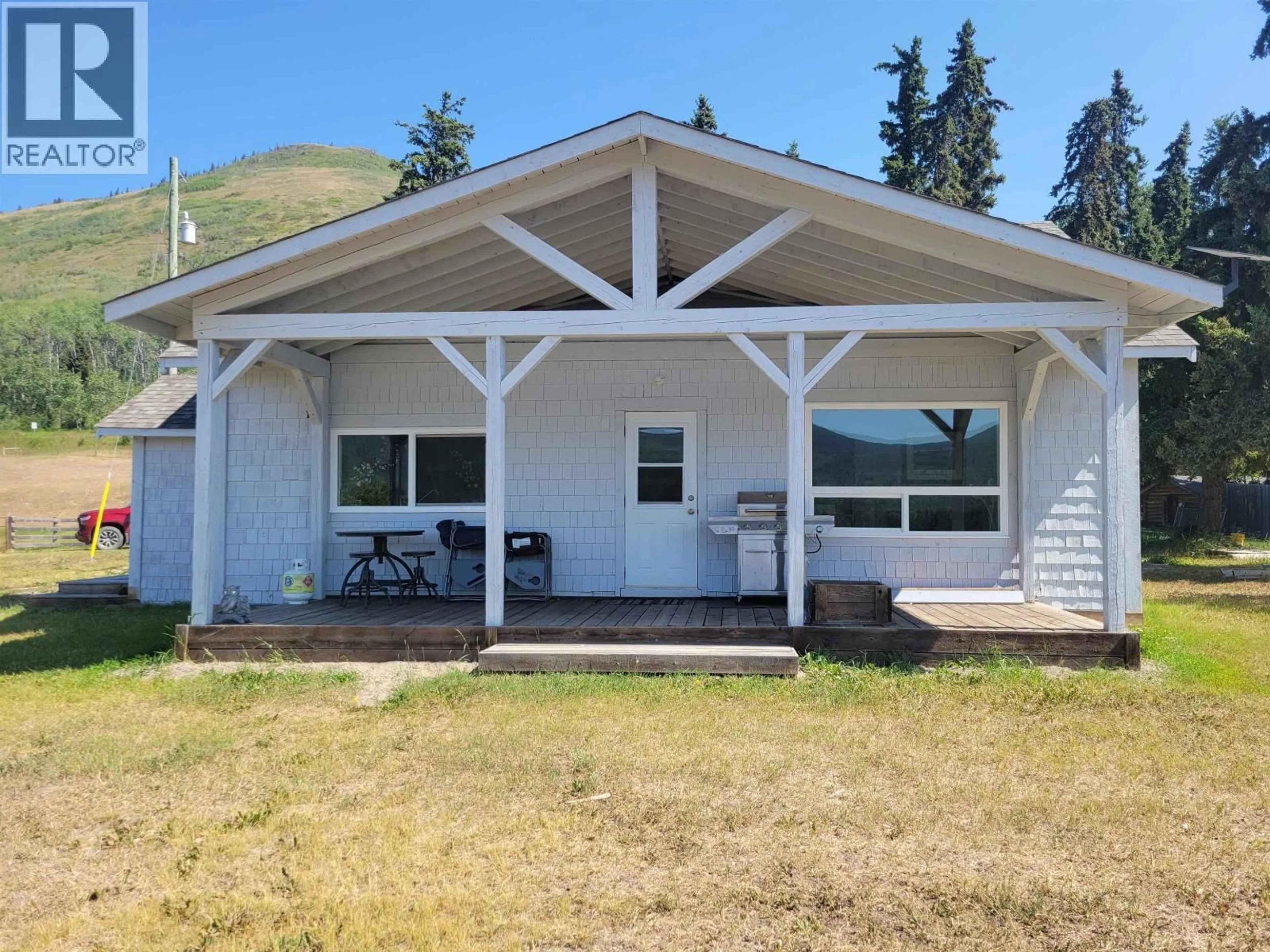 Home with vinyl exterior material, mountain view for 10443 NITHI PIT ROAD, Fraser Lake British Columbia V0J1S0