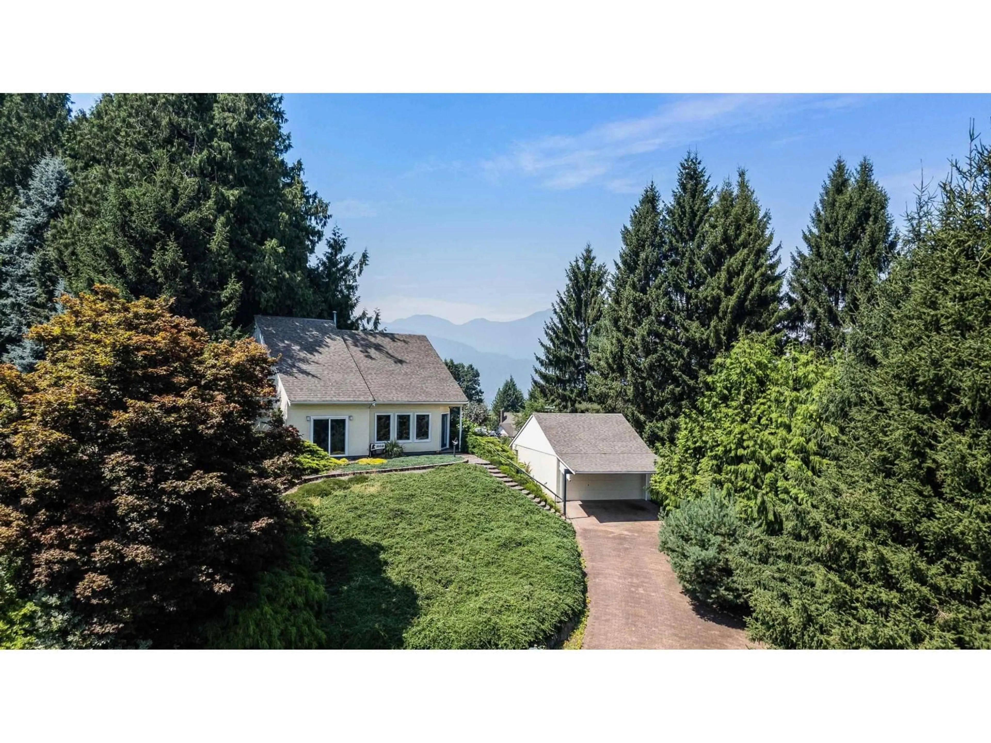 A pic from outside/outdoor area/front of a property/back of a property/a pic from drone, mountain view for 10021 FALCON CRESCENT, Chilliwack British Columbia V2P7R3