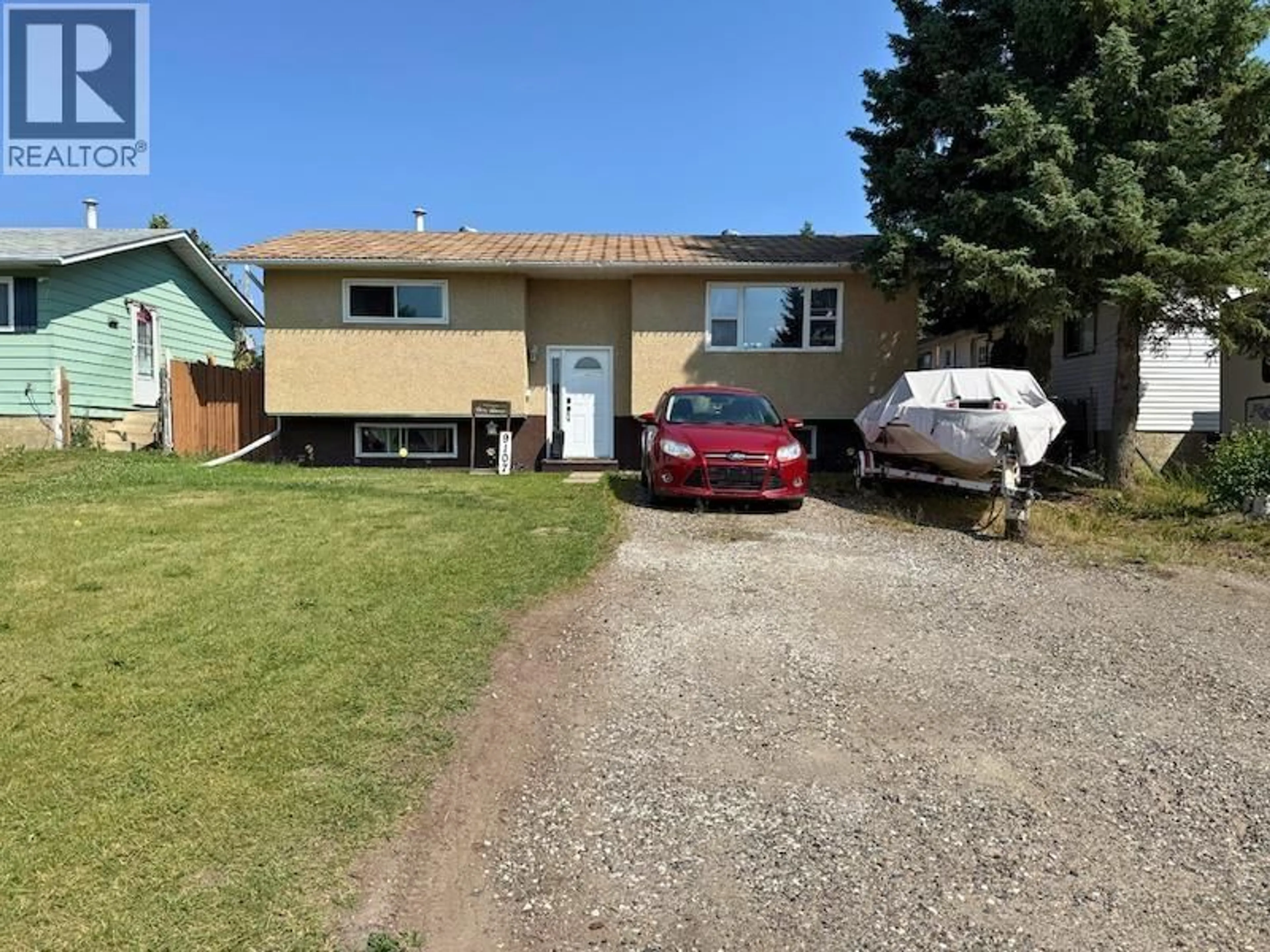 A pic from outside/outdoor area/front of a property/back of a property/a pic from drone, street for 9107 91ST STREET, Fort St. John British Columbia V1J4V4