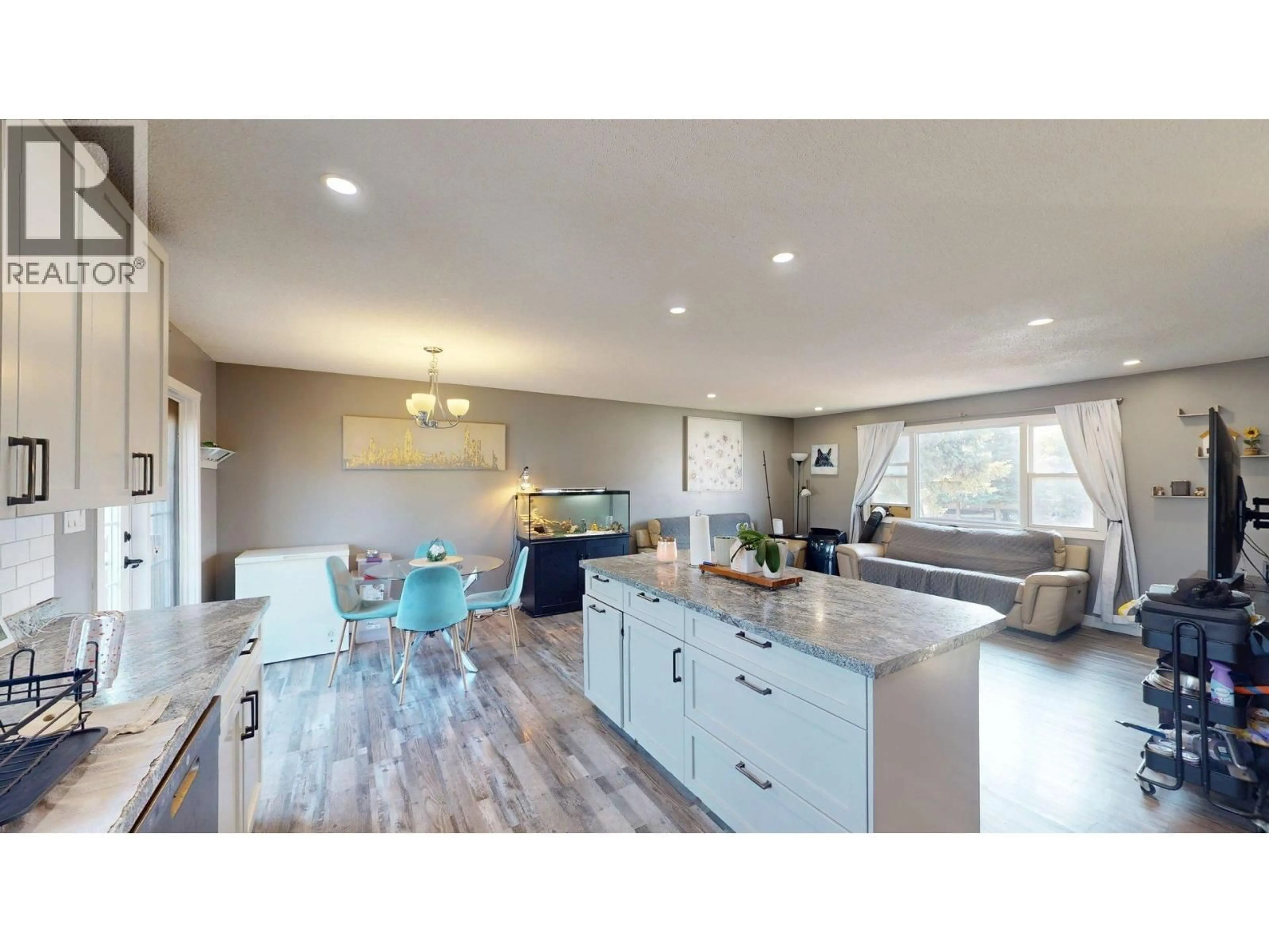 Open concept kitchen, wood/laminate floor for 9107 91ST STREET, Fort St. John British Columbia V1J4V4