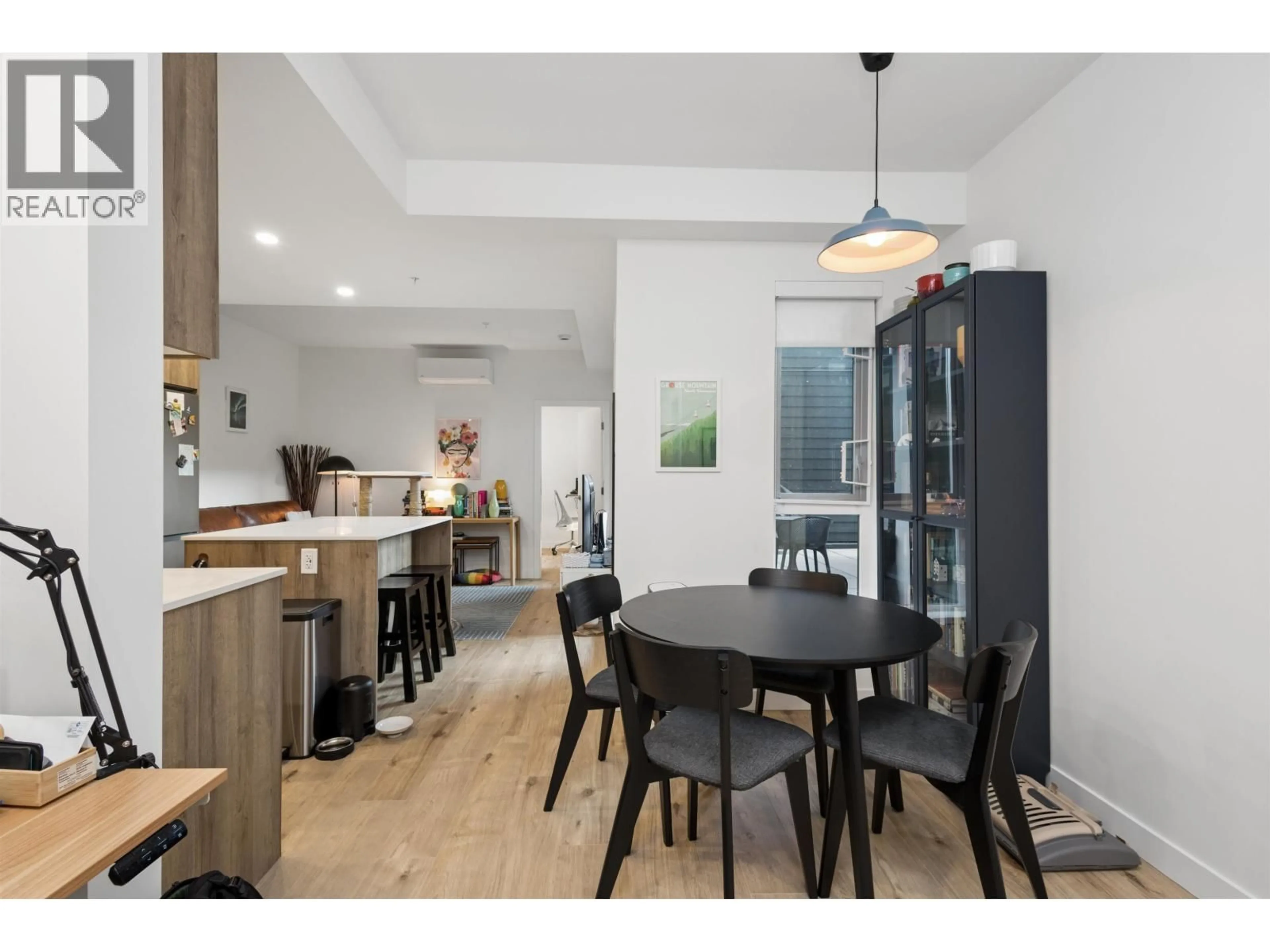 Open concept kitchen, wood/laminate floor for 204 - 3596 MALSUM DRIVE, North Vancouver British Columbia V7G0B5