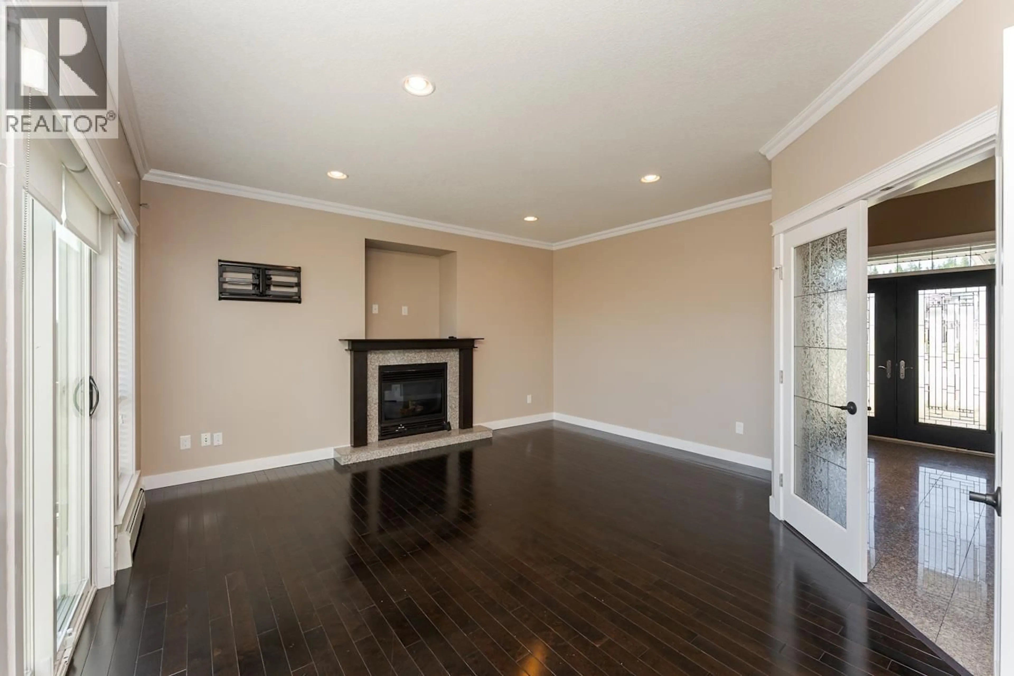 Living room with furniture, wood/laminate floor for 7614 ST. ANDREW COURT, Prince George British Columbia V2N0B6