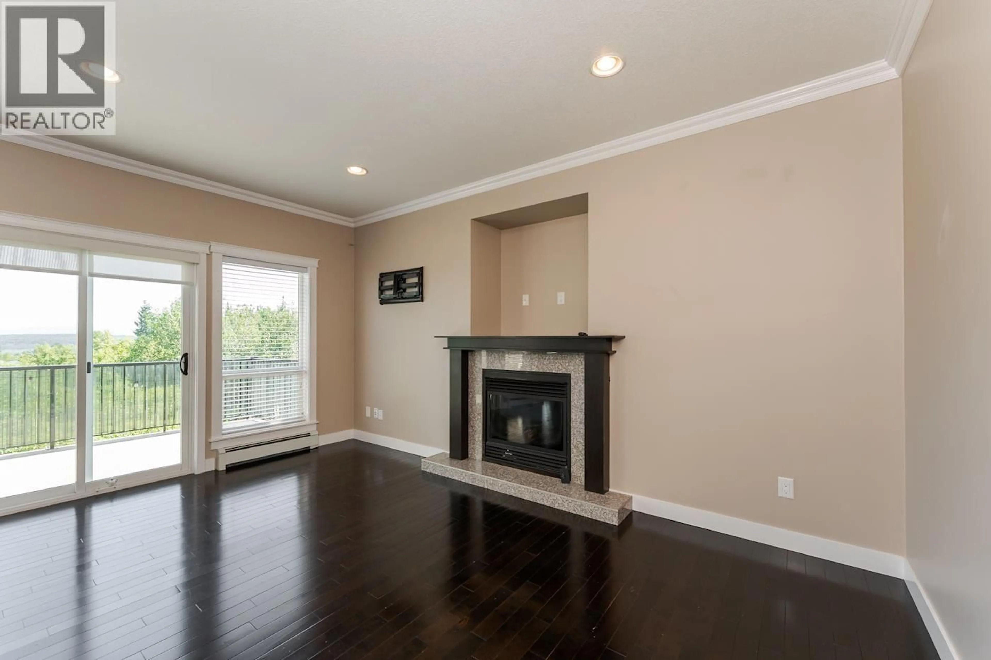 Living room with furniture, wood/laminate floor for 7614 ST. ANDREW COURT, Prince George British Columbia V2N0B6