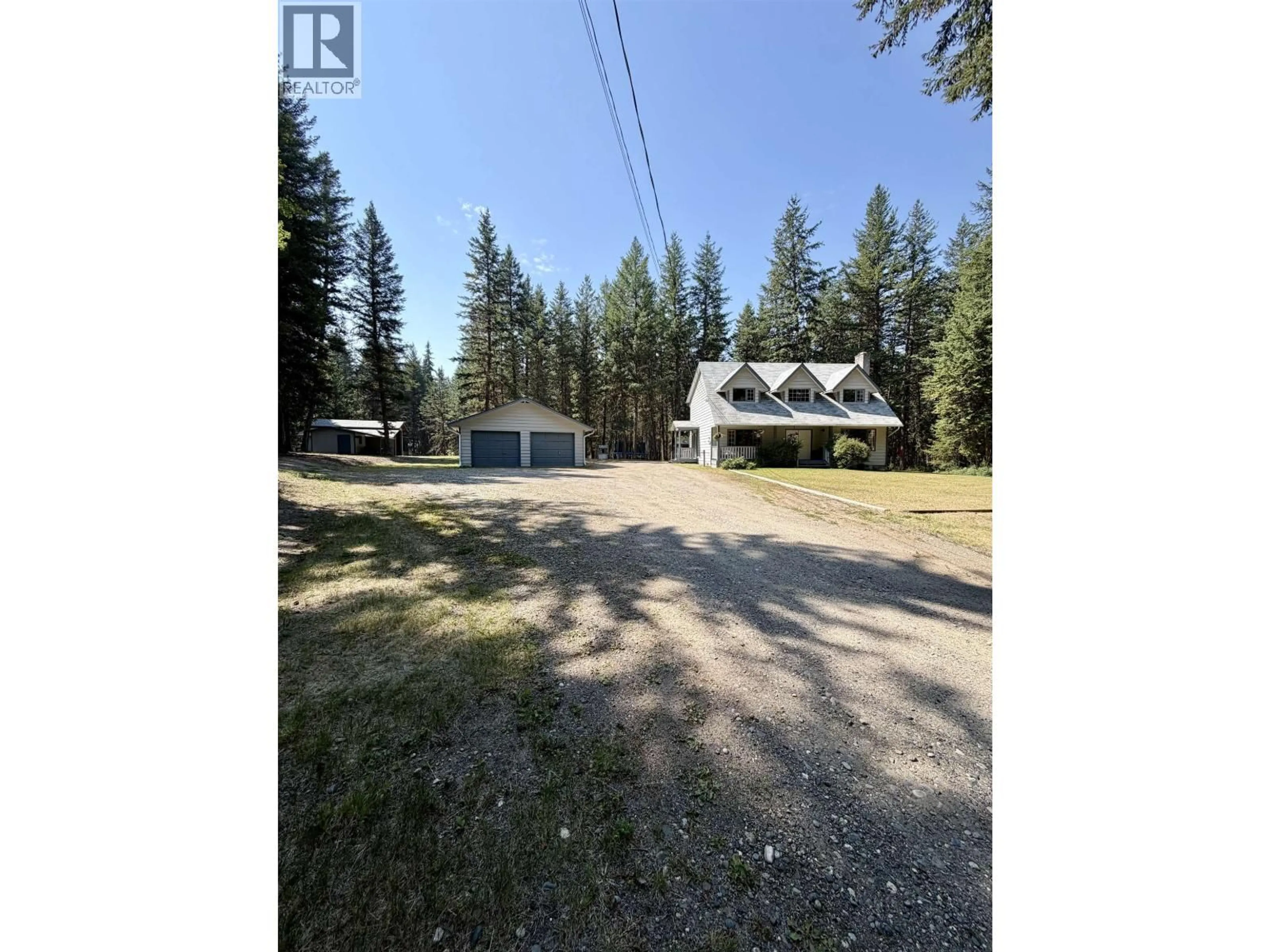 A pic from outside/outdoor area/front of a property/back of a property/a pic from drone, unknown for 3228 DAVISON ROAD, 150 Mile House British Columbia V0K2G0