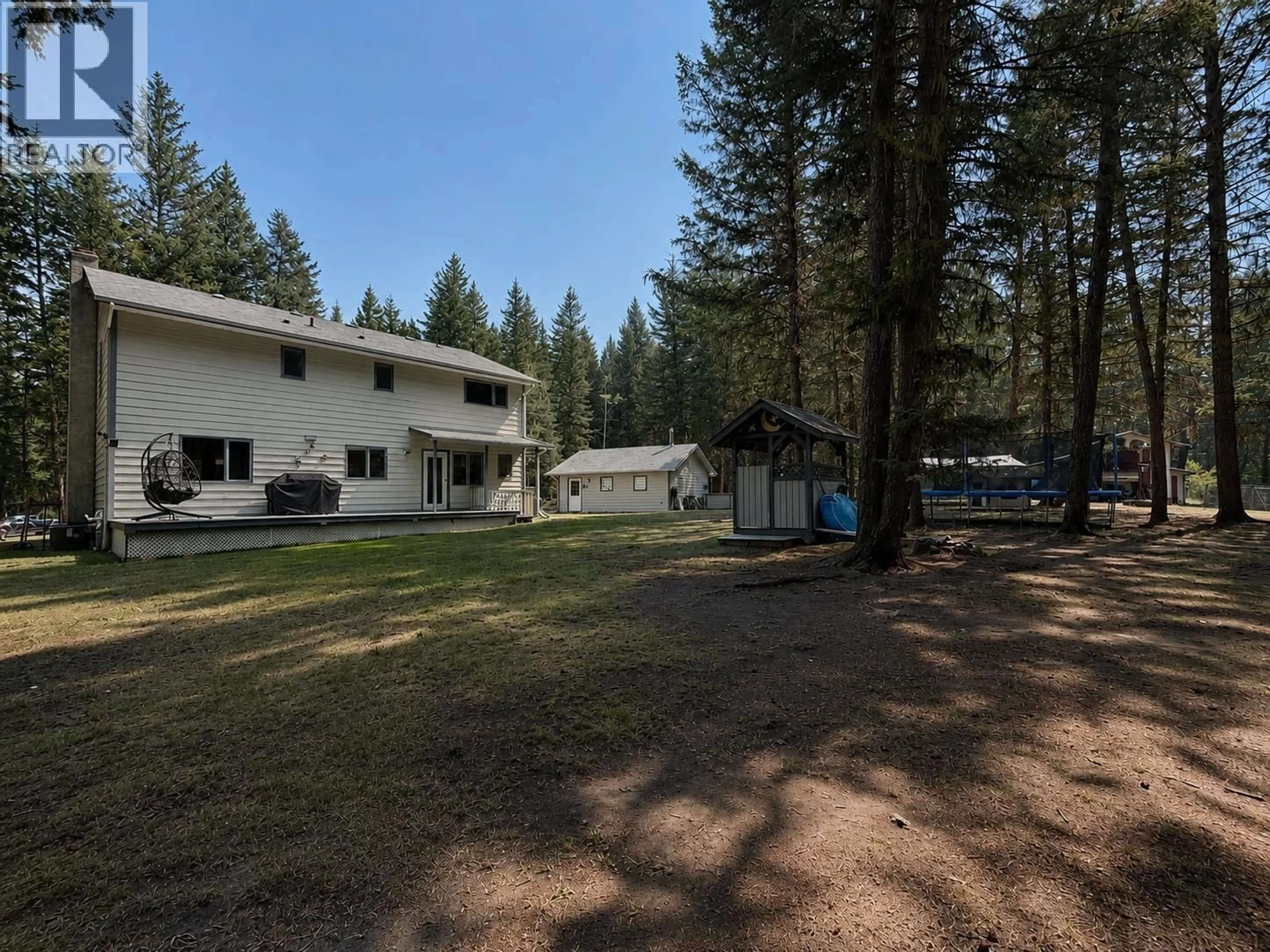 A pic from outside/outdoor area/front of a property/back of a property/a pic from drone, forest/trees view for 3228 DAVISON ROAD, 150 Mile House British Columbia V0K2G0
