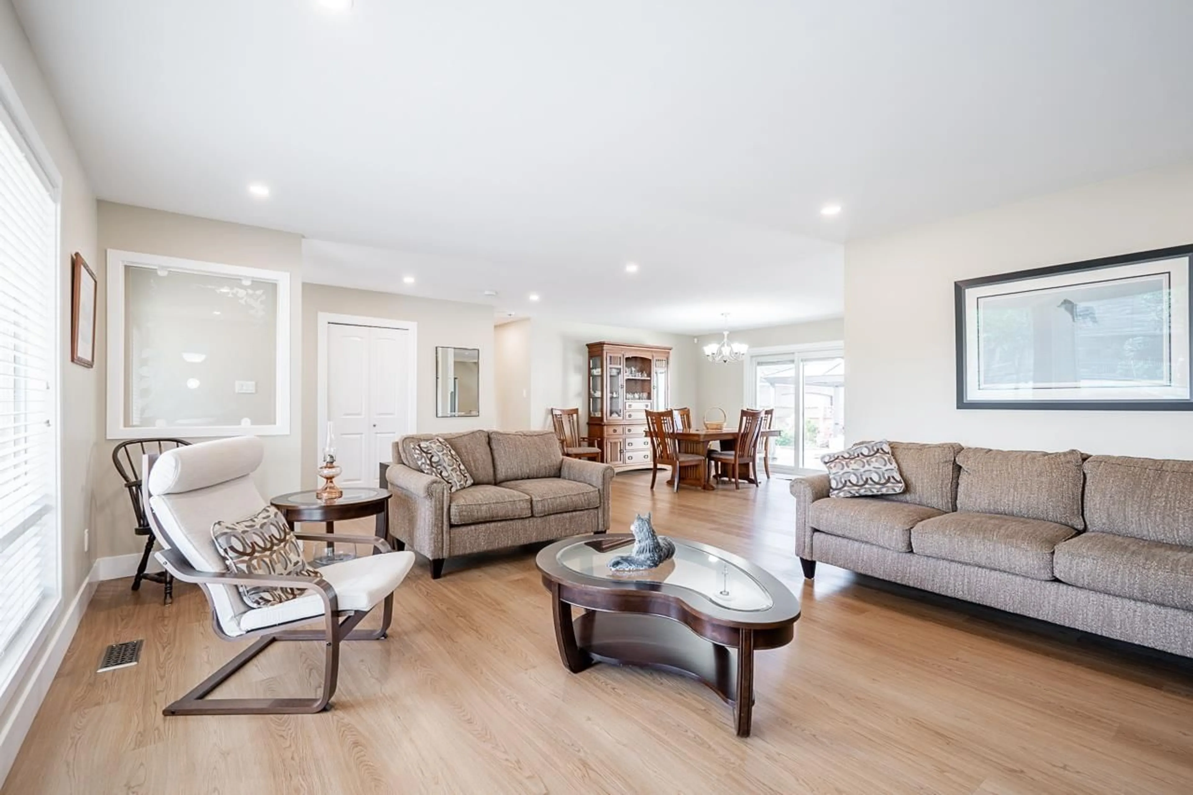 Living room with furniture, wood/laminate floor for 21711 52 AVENUE, Langley British Columbia V2Y1L7