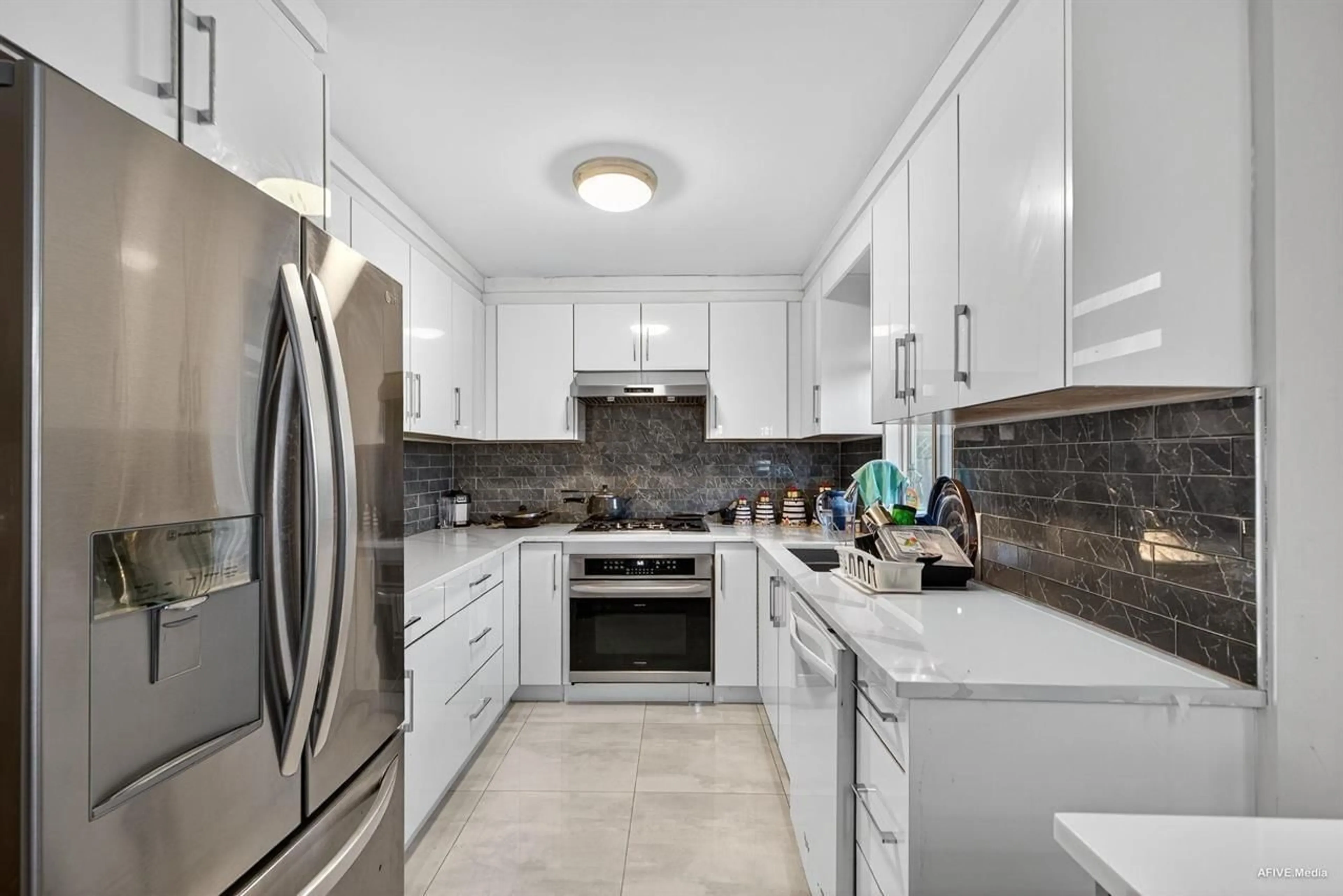 Contemporary kitchen, ceramic/tile floor for 12079 84A AVENUE, Surrey British Columbia V3W0S7