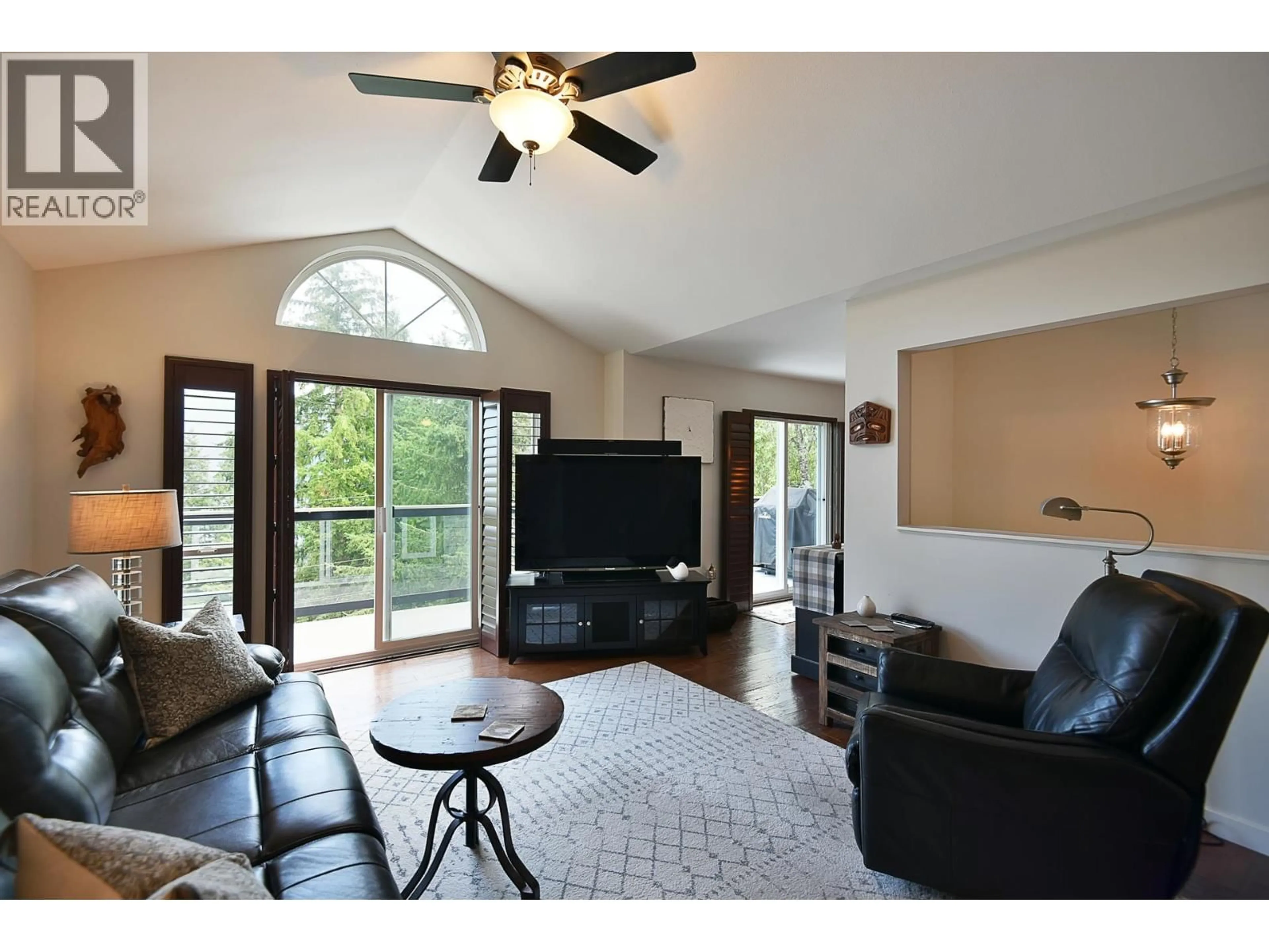 Living room with furniture, wood/laminate floor for 5866D TURNSTONE CRESCENT, Sechelt British Columbia V7Z0L9