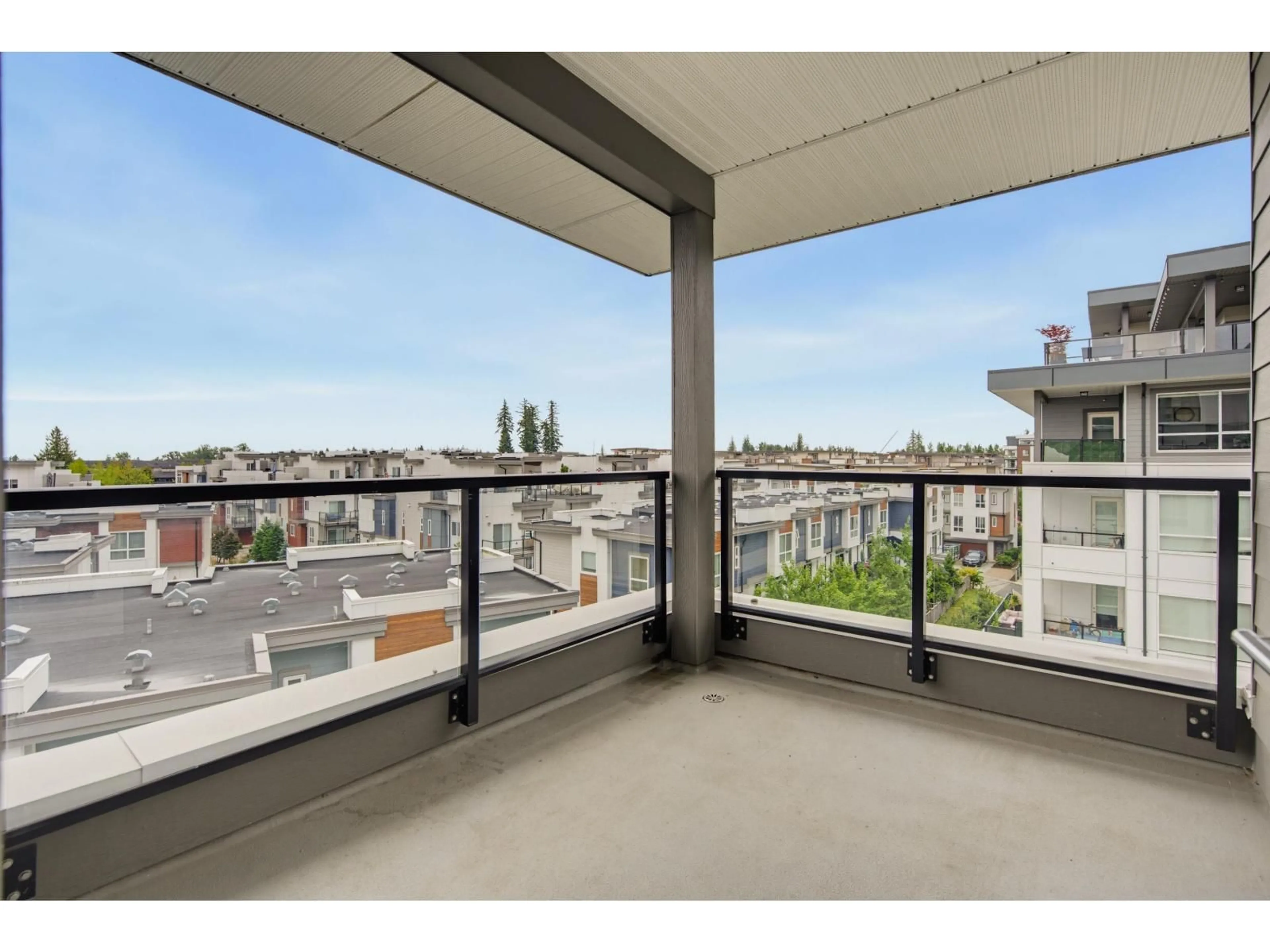 Balcony in the apartment, city buildings view from balcony for B503 - 20834 80 AVENUE, Langley British Columbia V2Y3M5
