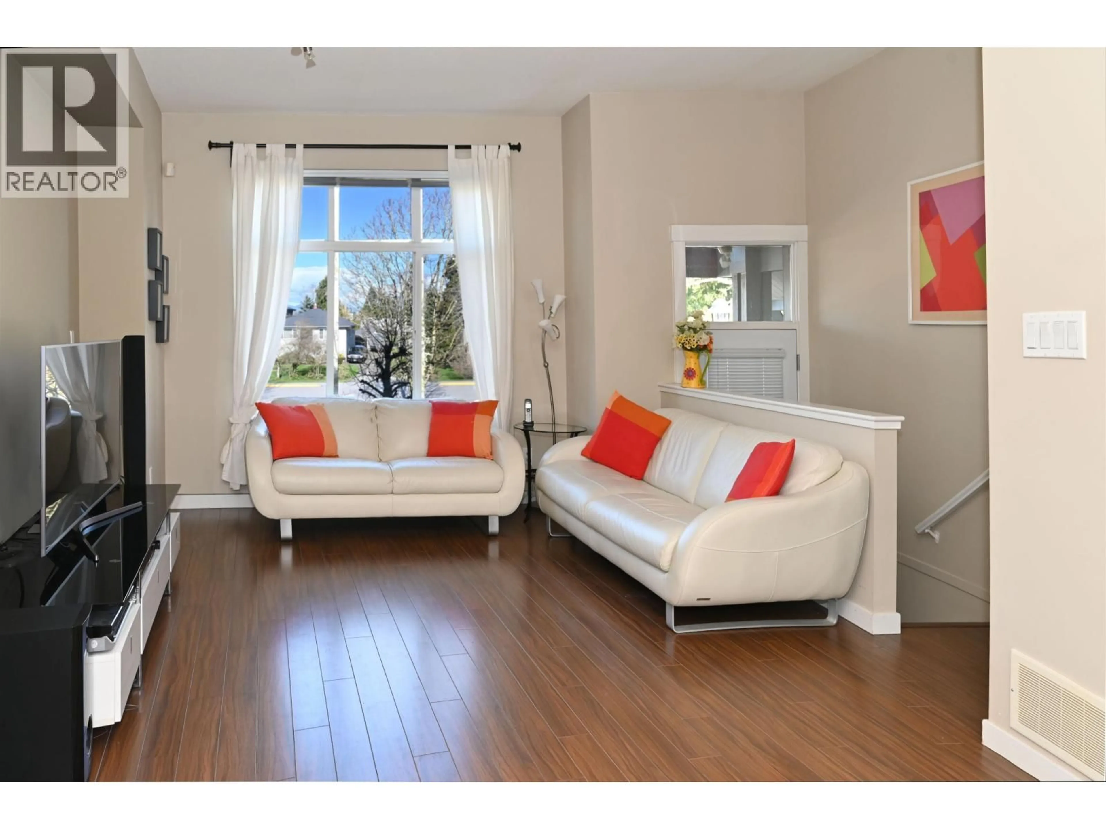Living room with furniture, wood/laminate floor for 2 - 9800 ODLIN ROAD, Richmond British Columbia V6X0C2
