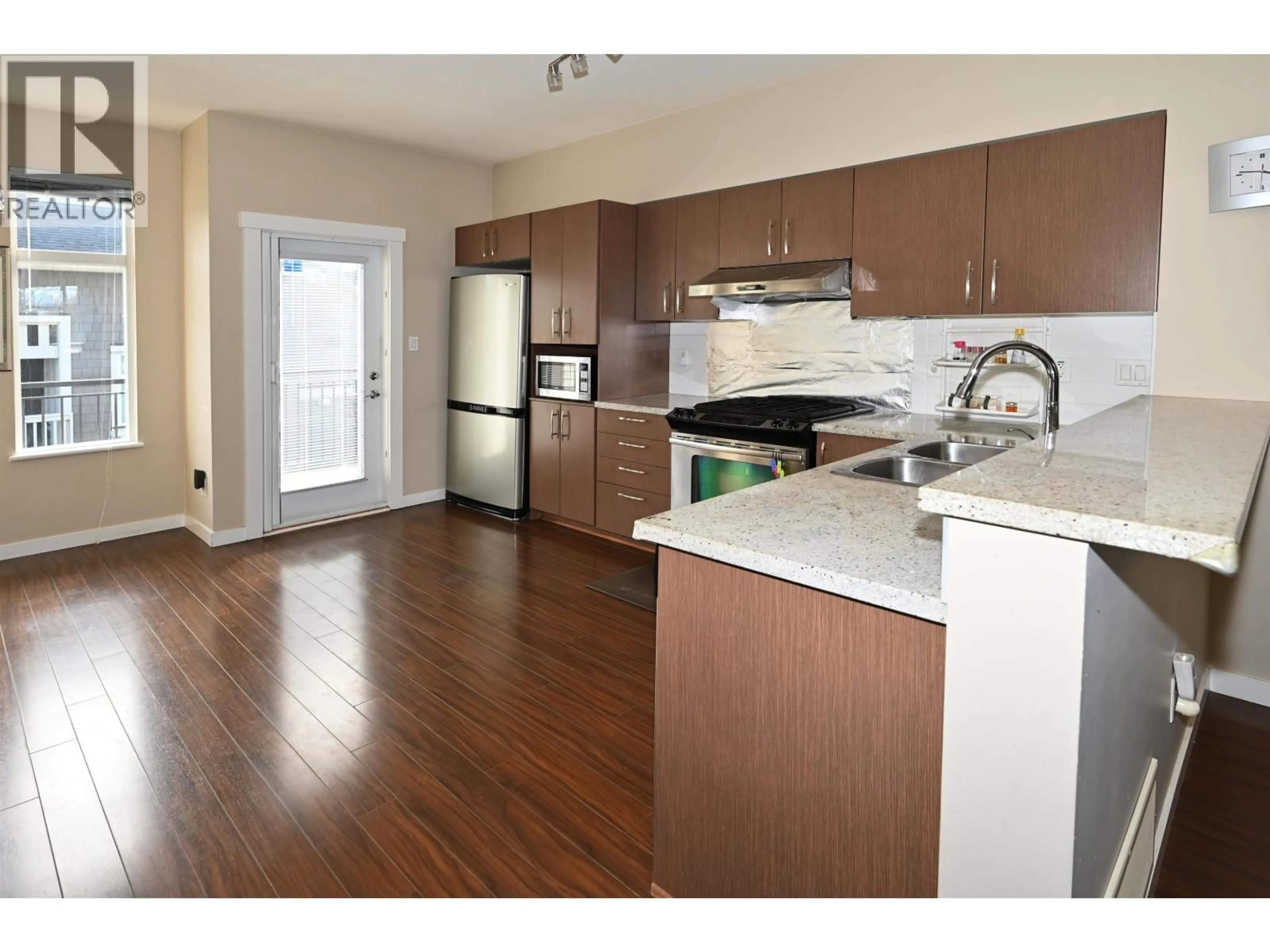 Open concept kitchen, wood/laminate floor for 2 - 9800 ODLIN ROAD, Richmond British Columbia V6X0C2