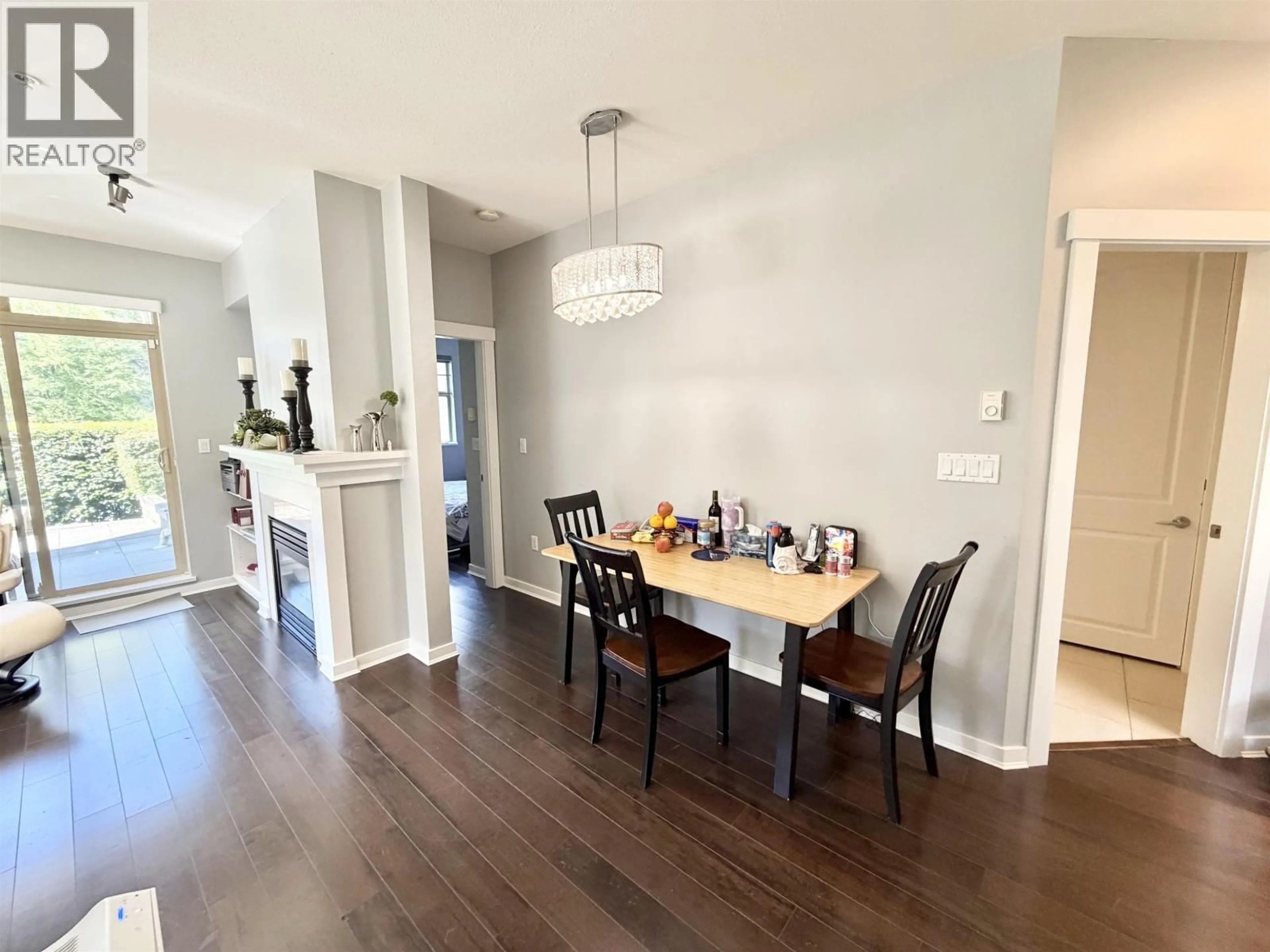 Dining room, wood/laminate floor for 103 - 4883 MACLURE MEWS, Vancouver British Columbia V6J5M8