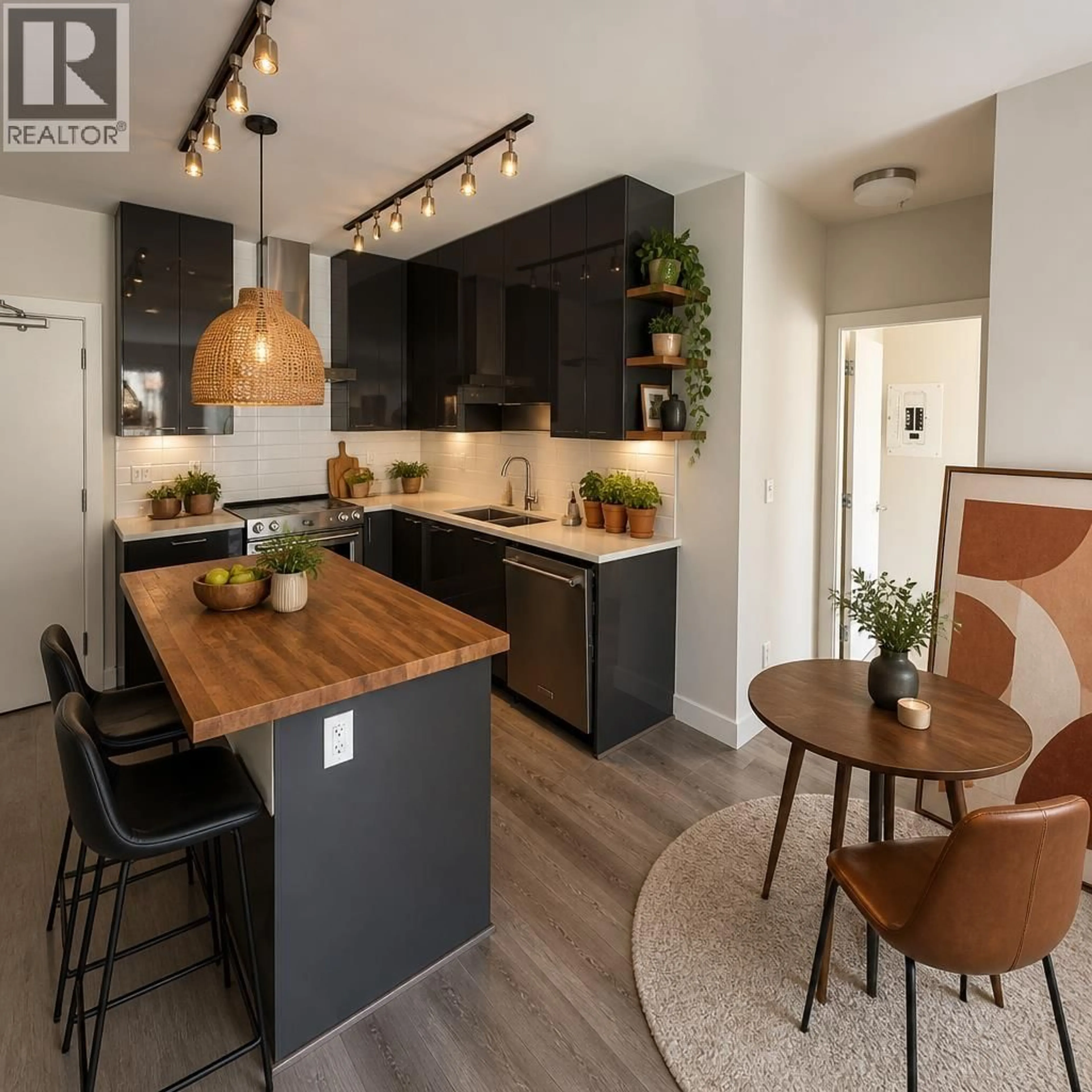 Open concept kitchen, wood/laminate floor for 101 - 1768 GILMORE AVENUE, Burnaby British Columbia V5C0L4