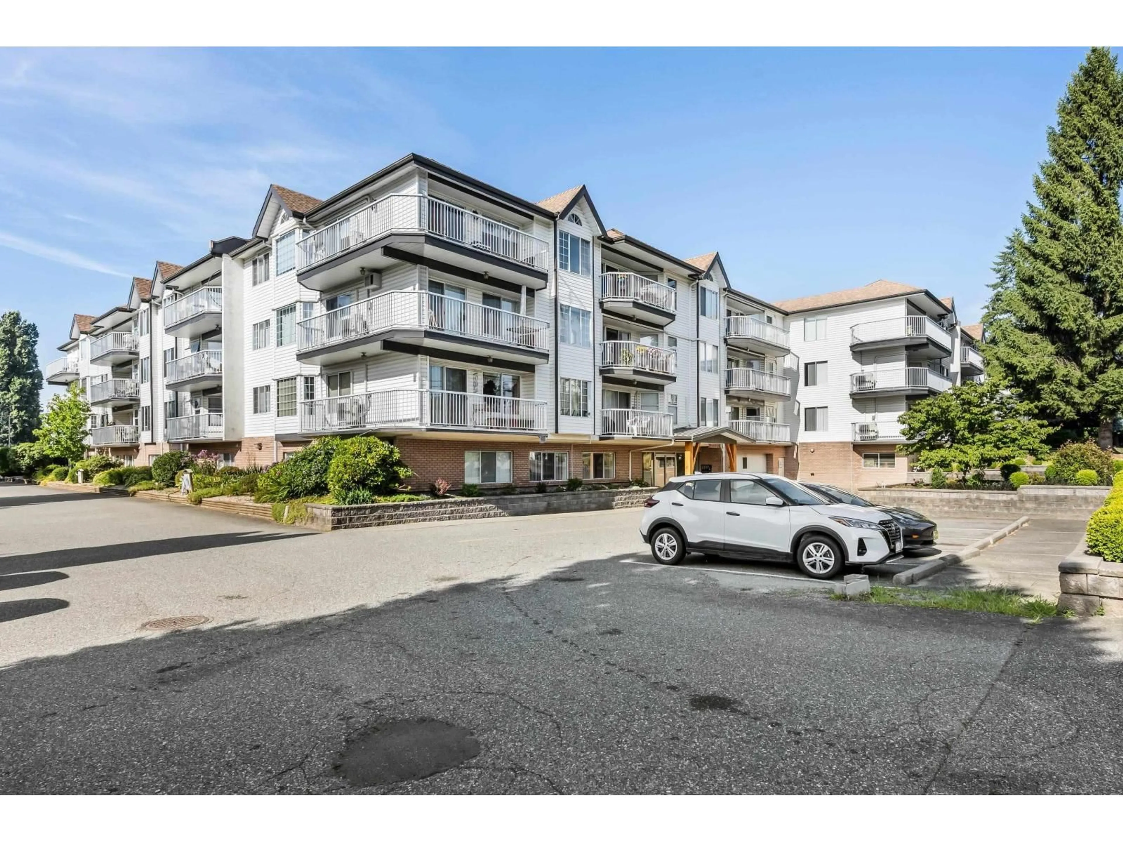 A pic from outside/outdoor area/front of a property/back of a property/a pic from drone, street for 208 - 33535 KING ROAD, Abbotsford British Columbia V2S6Z5
