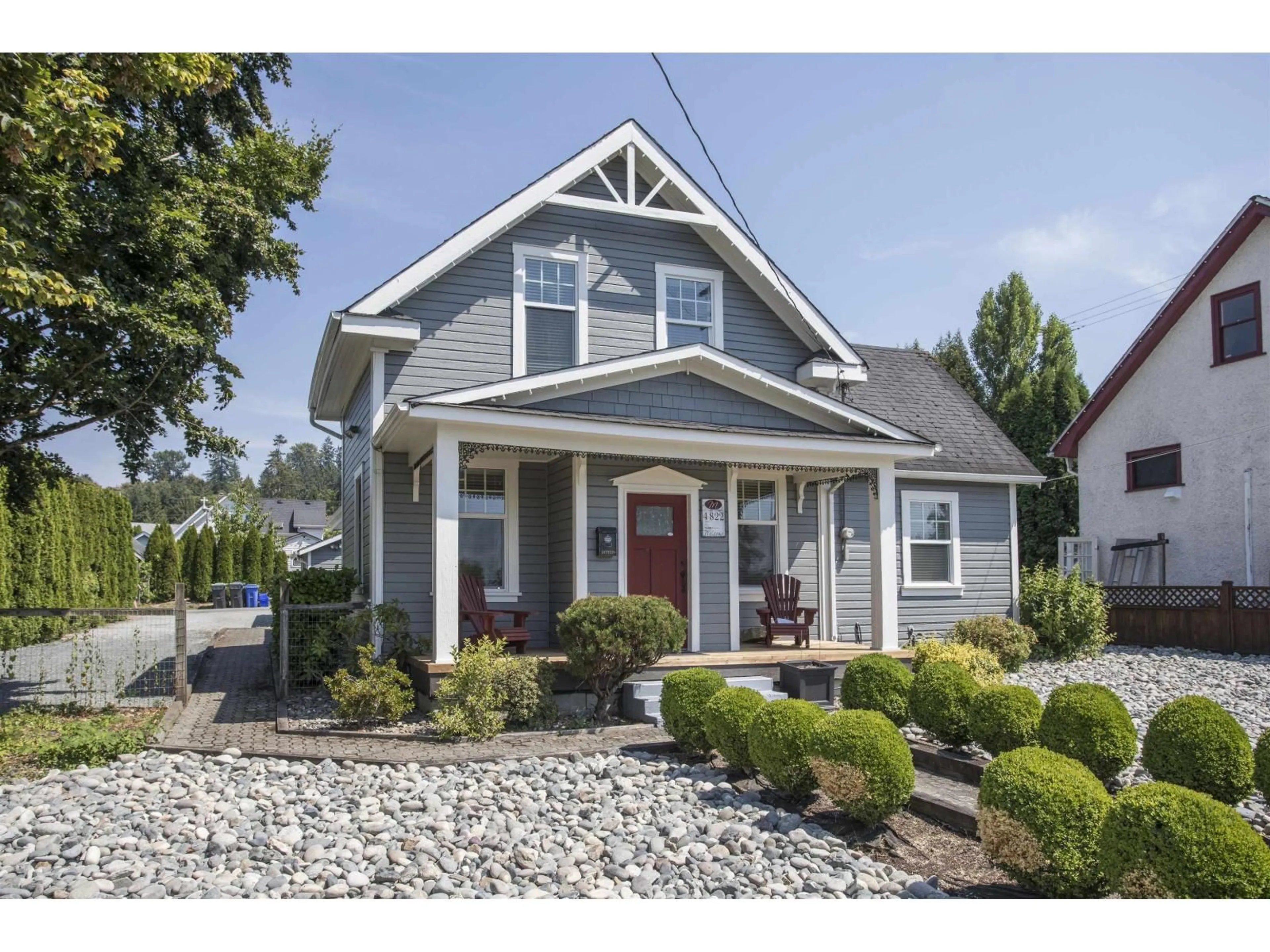 Home with vinyl exterior material, street for 4822 216 STREET, Langley British Columbia V3A2M7