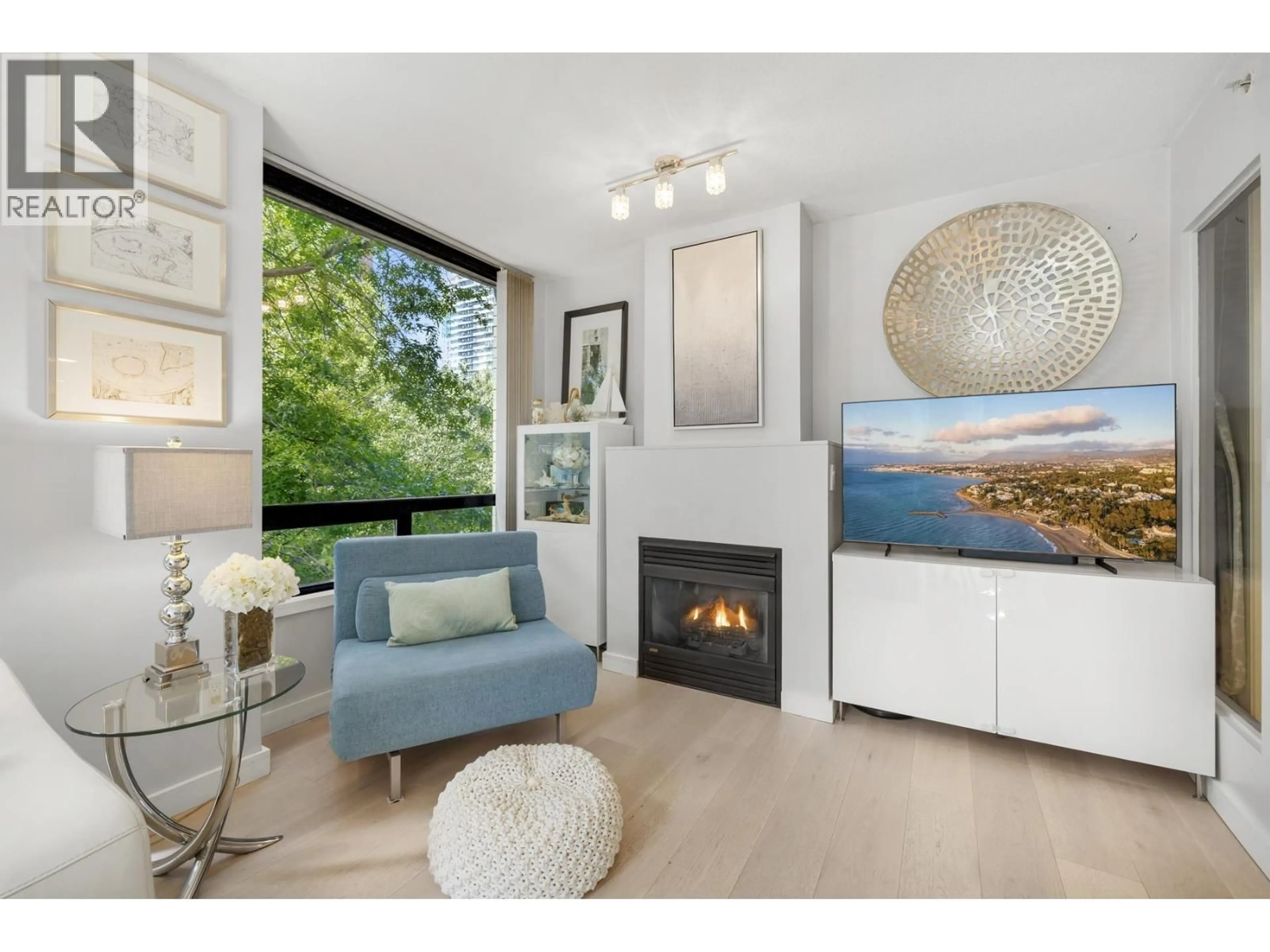 Living room with furniture, wood/laminate floor for 304 - 1003 BURNABY STREET, Vancouver British Columbia V6E4R7
