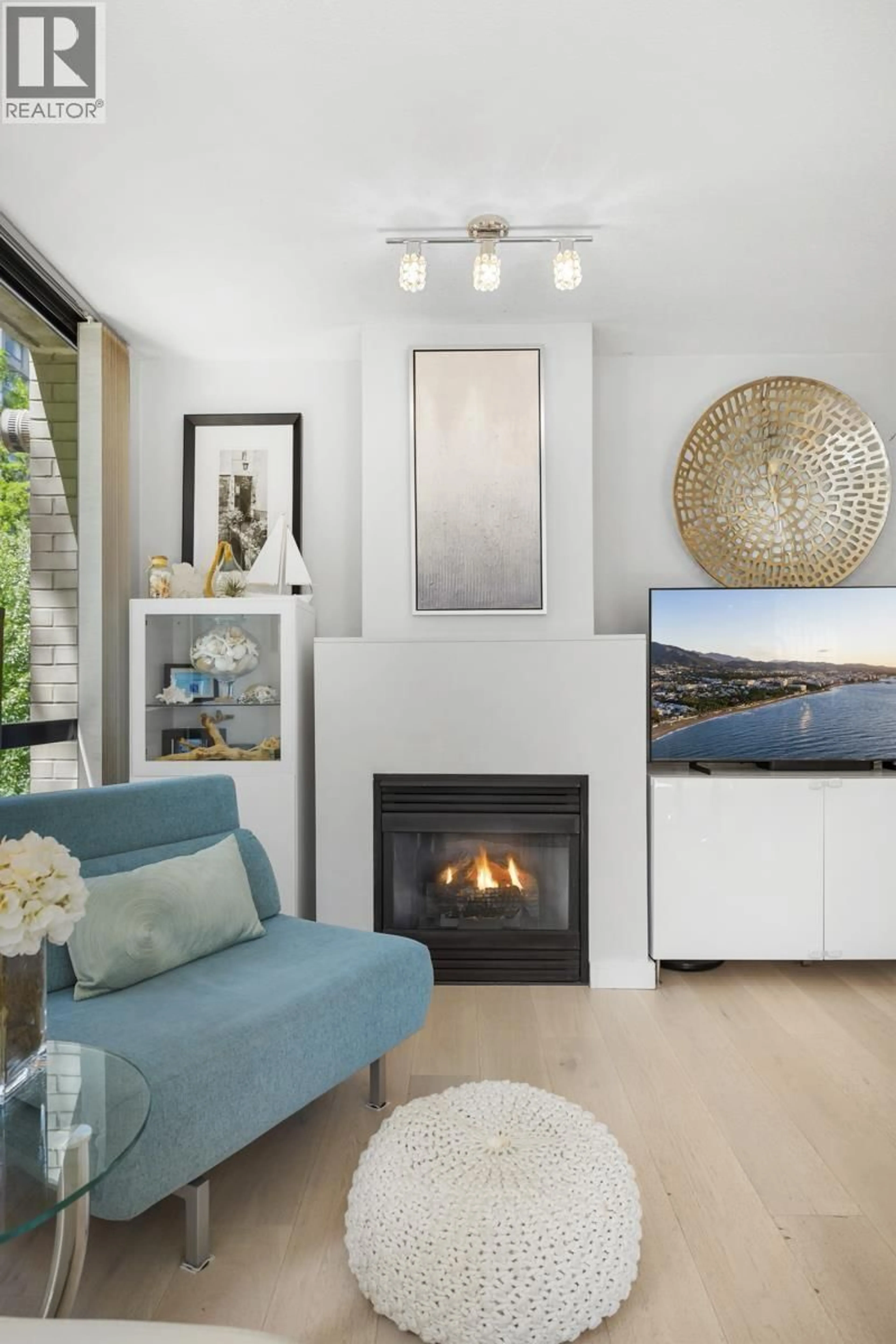 Living room with furniture, wood/laminate floor for 304 - 1003 BURNABY STREET, Vancouver British Columbia V6E4R7