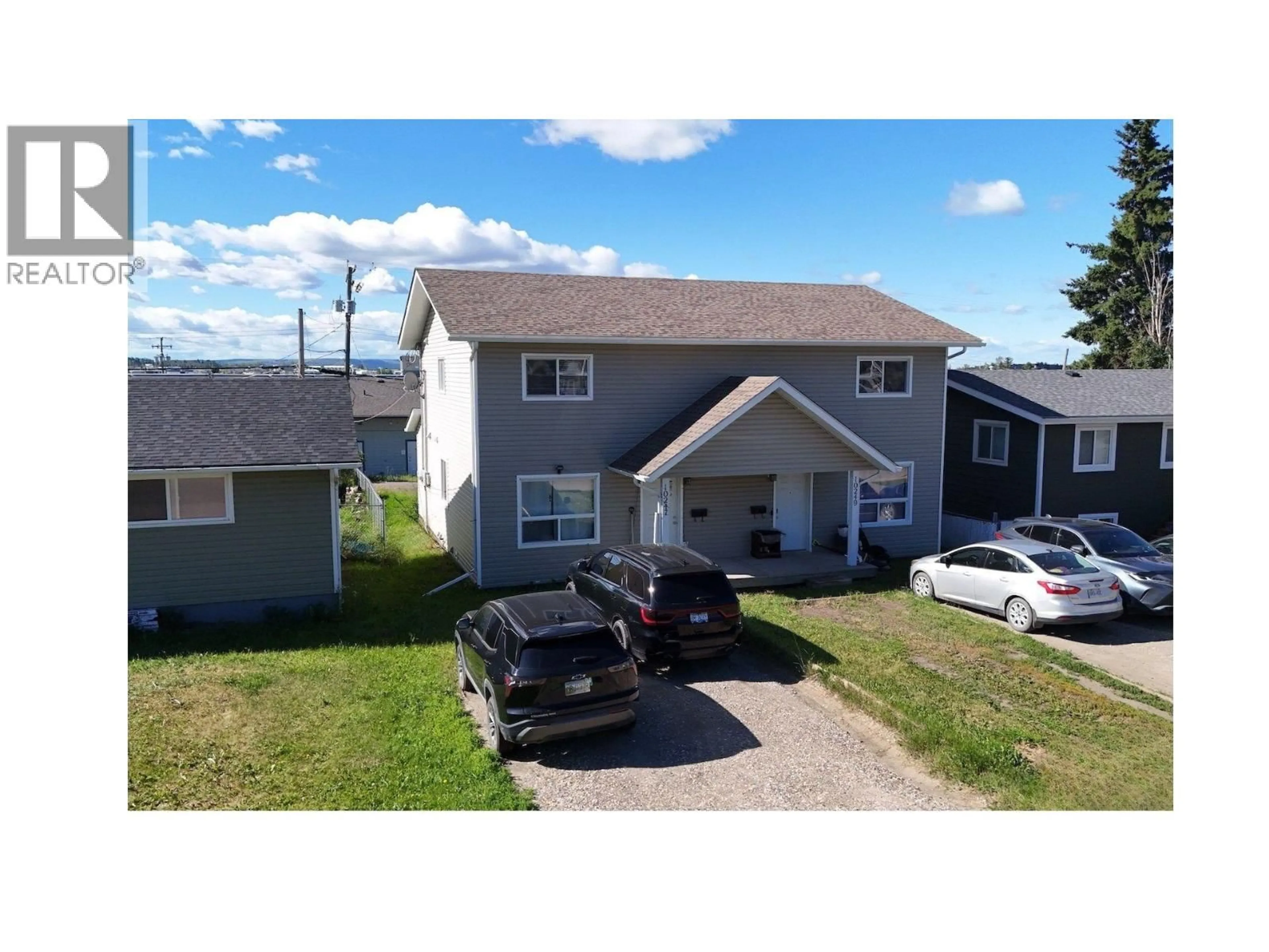 A pic from outside/outdoor area/front of a property/back of a property/a pic from drone, street for 10247 102 AVENUE, Fort St. John British Columbia V1J2E4