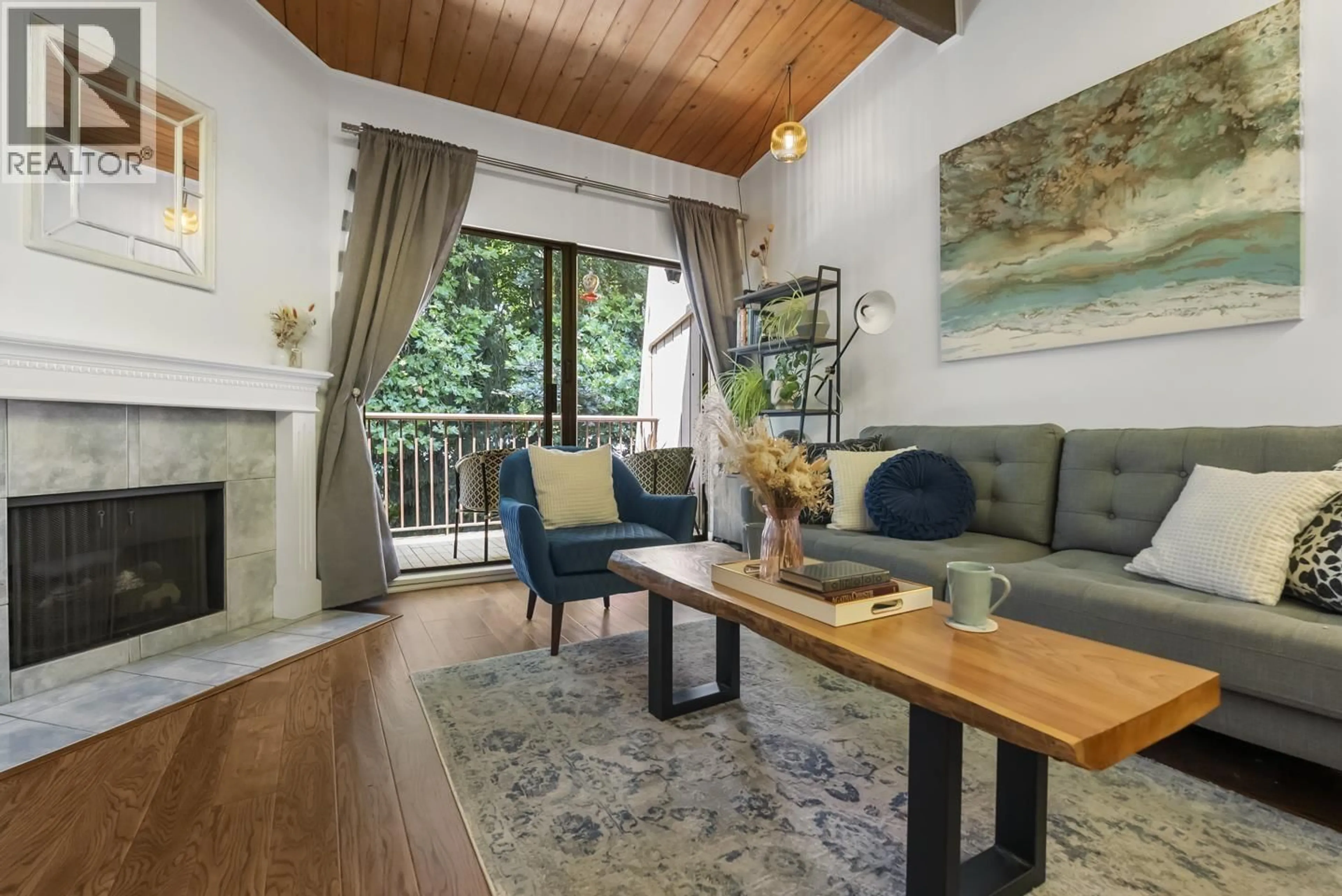Living room with furniture, wood/laminate floor for 311 - 9101 HORNE STREET, Burnaby British Columbia V3N4M3