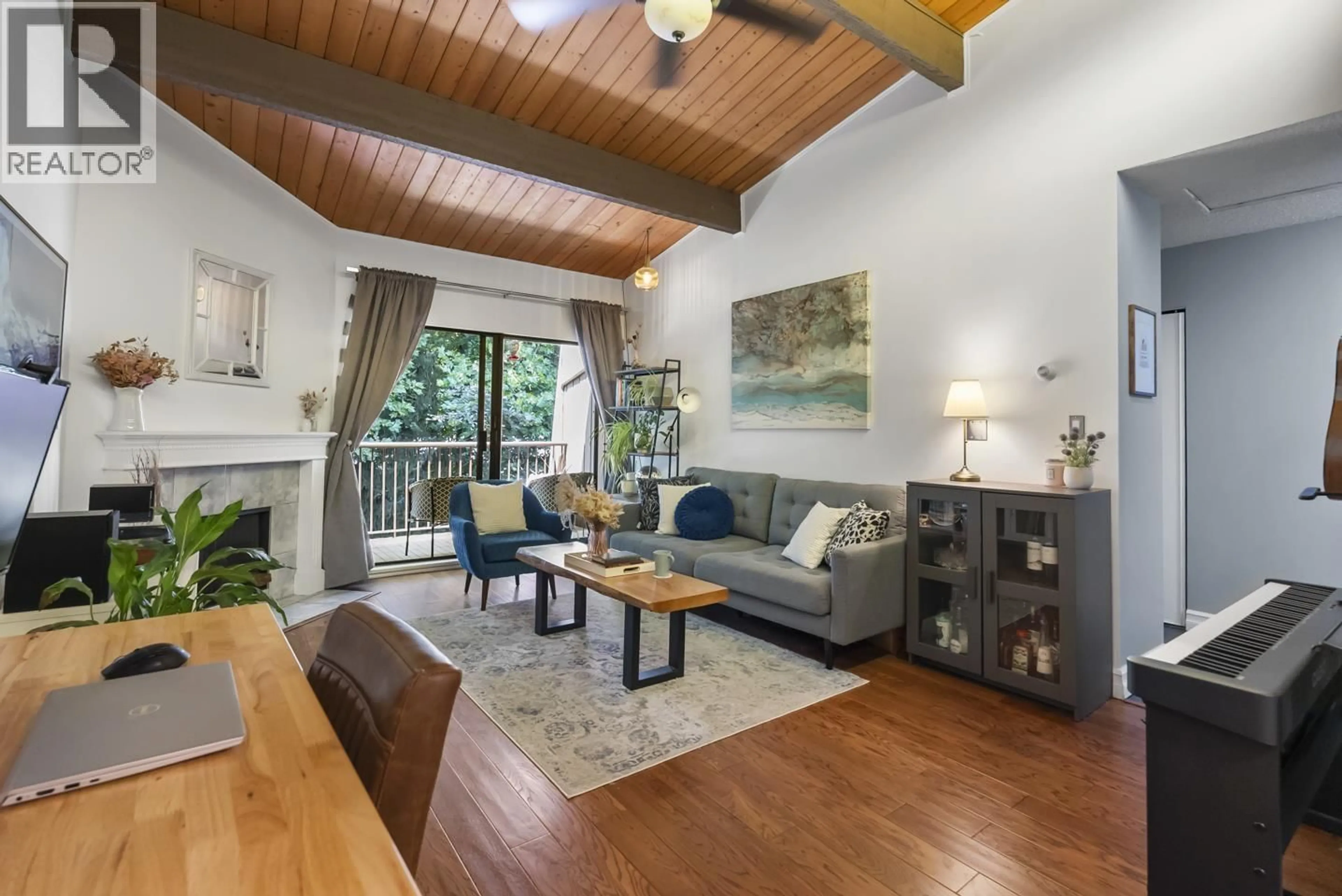 Living room with furniture, wood/laminate floor for 311 - 9101 HORNE STREET, Burnaby British Columbia V3N4M3