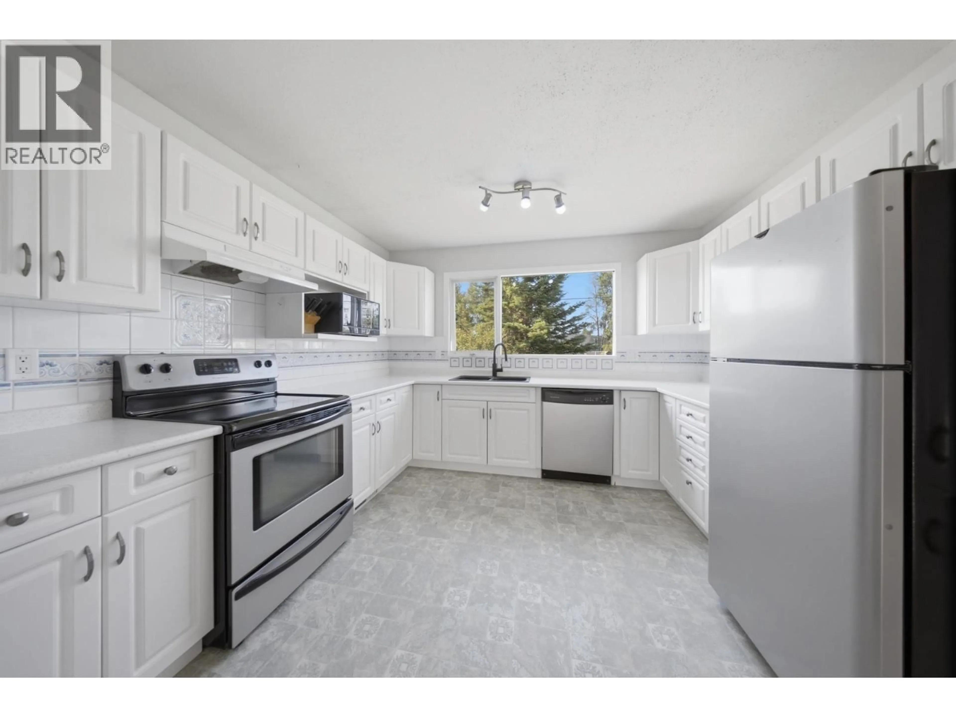 Standard kitchen, ceramic/tile floor for 12240 JUNIPER AVENUE, Fort St. John British Columbia V1J8E5