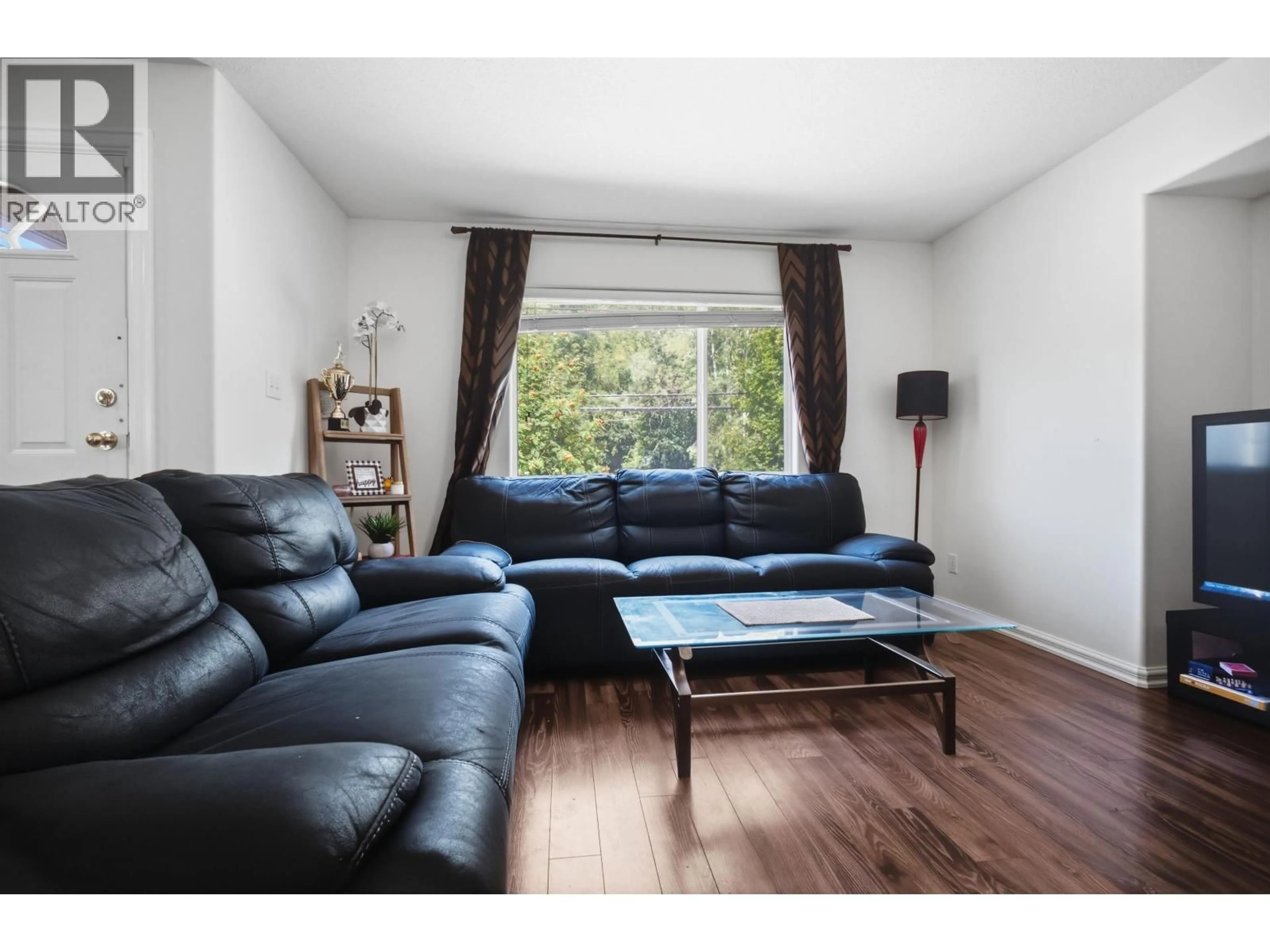 Living room with furniture, wood/laminate floor for 4449 PARK AVENUE, Terrace British Columbia V8G1T8