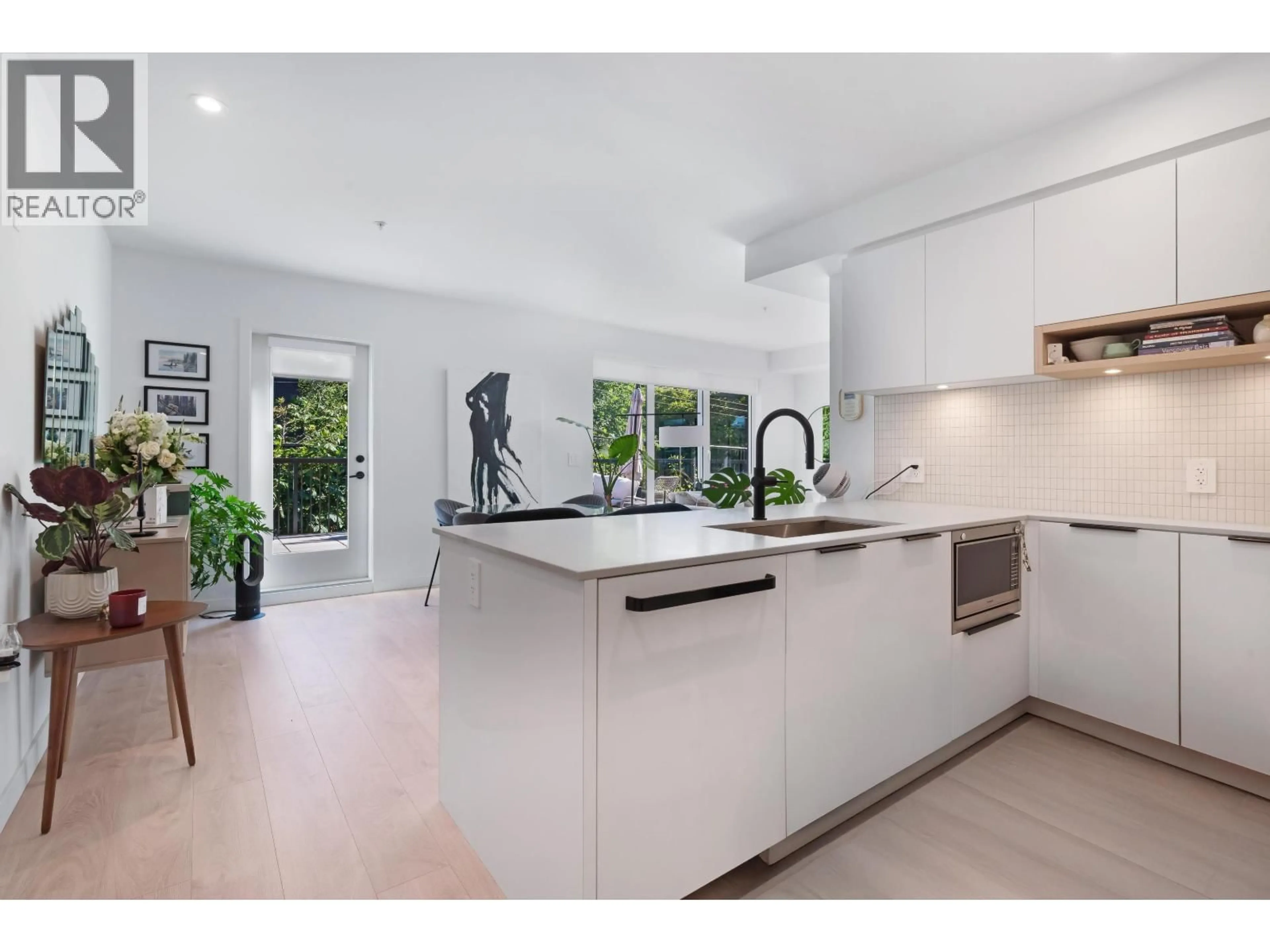 Open concept kitchen, unknown for 221 - 2520 GUELPH STREET, Vancouver British Columbia V5T0K7