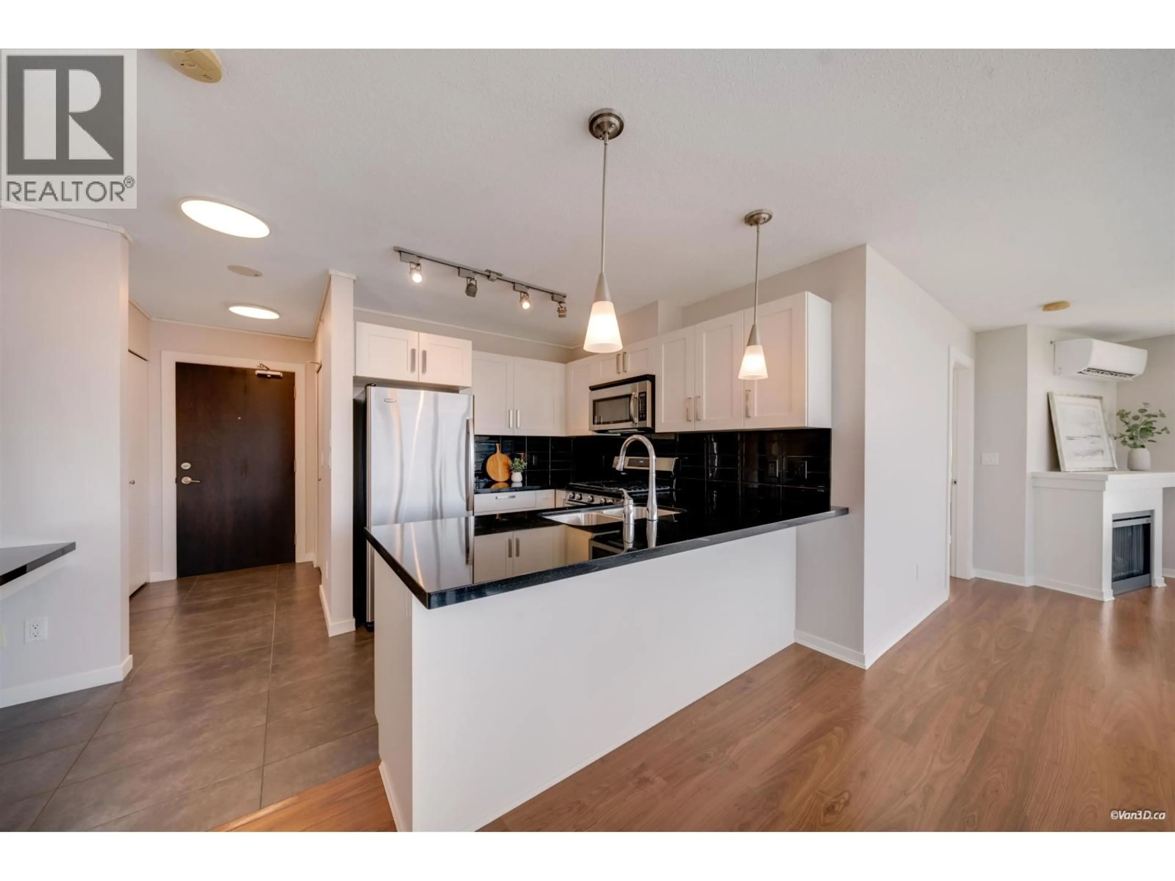 Open concept kitchen, wood/laminate floor for 807 - 2133 DOUGLAS ROAD, Burnaby British Columbia V5C0E9