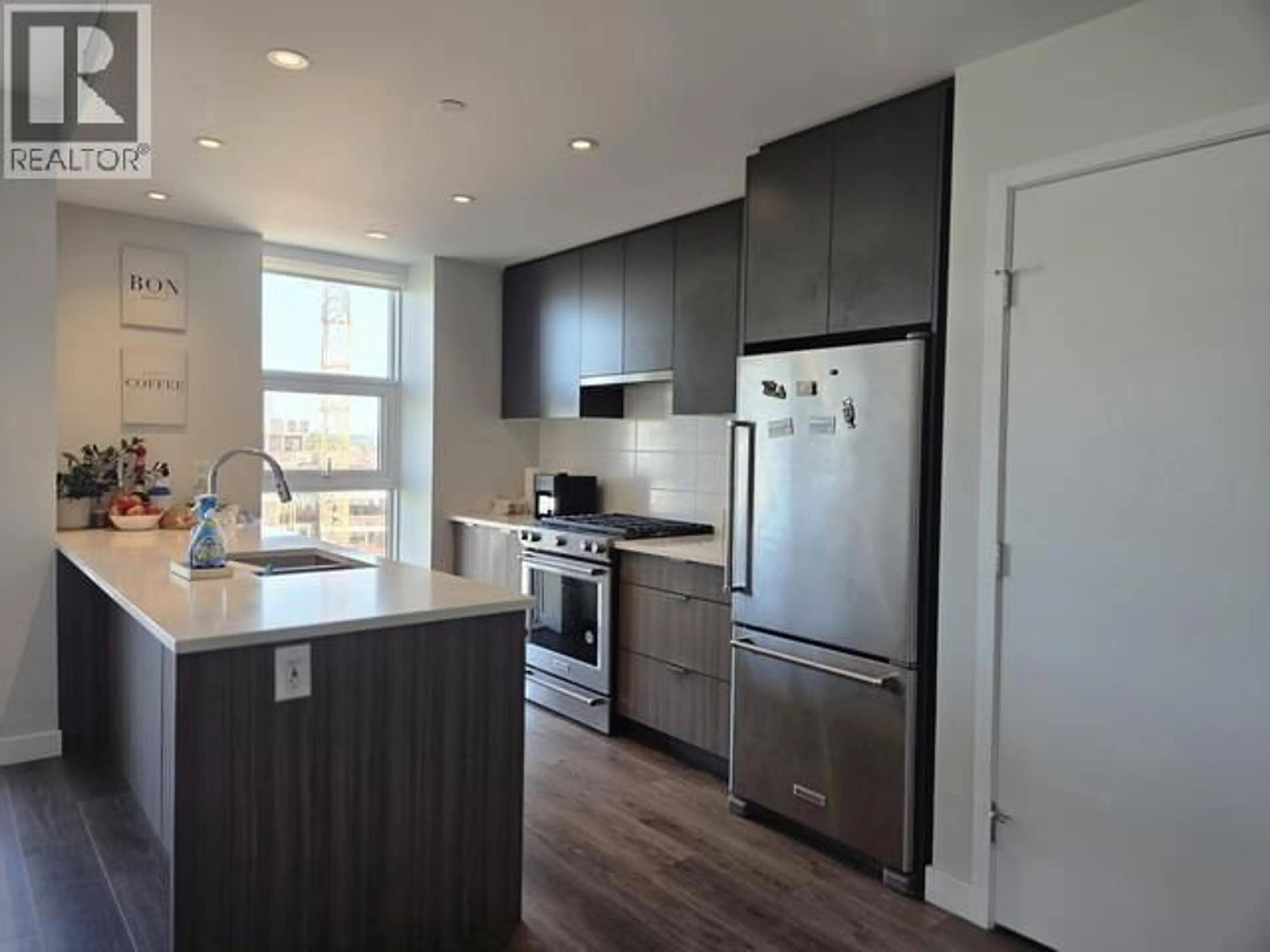Open concept kitchen, wood/laminate floor for 907 - 3430 KENT AVENUE SOUTH, Vancouver British Columbia V5S0G7