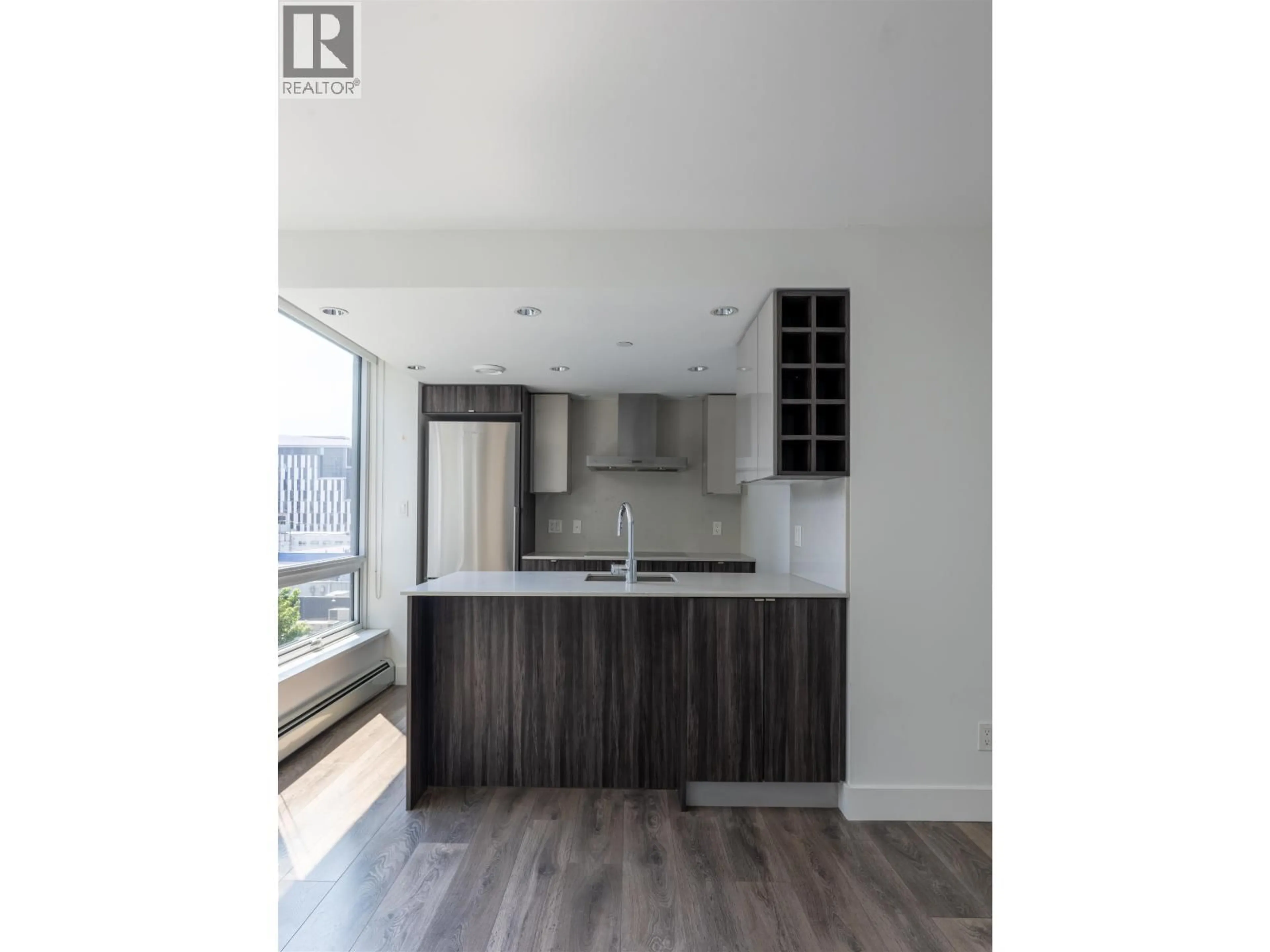 Open concept kitchen, wood/laminate floor for 706 - 1788 COLUMBIA STREET, Vancouver British Columbia V5Y0L7