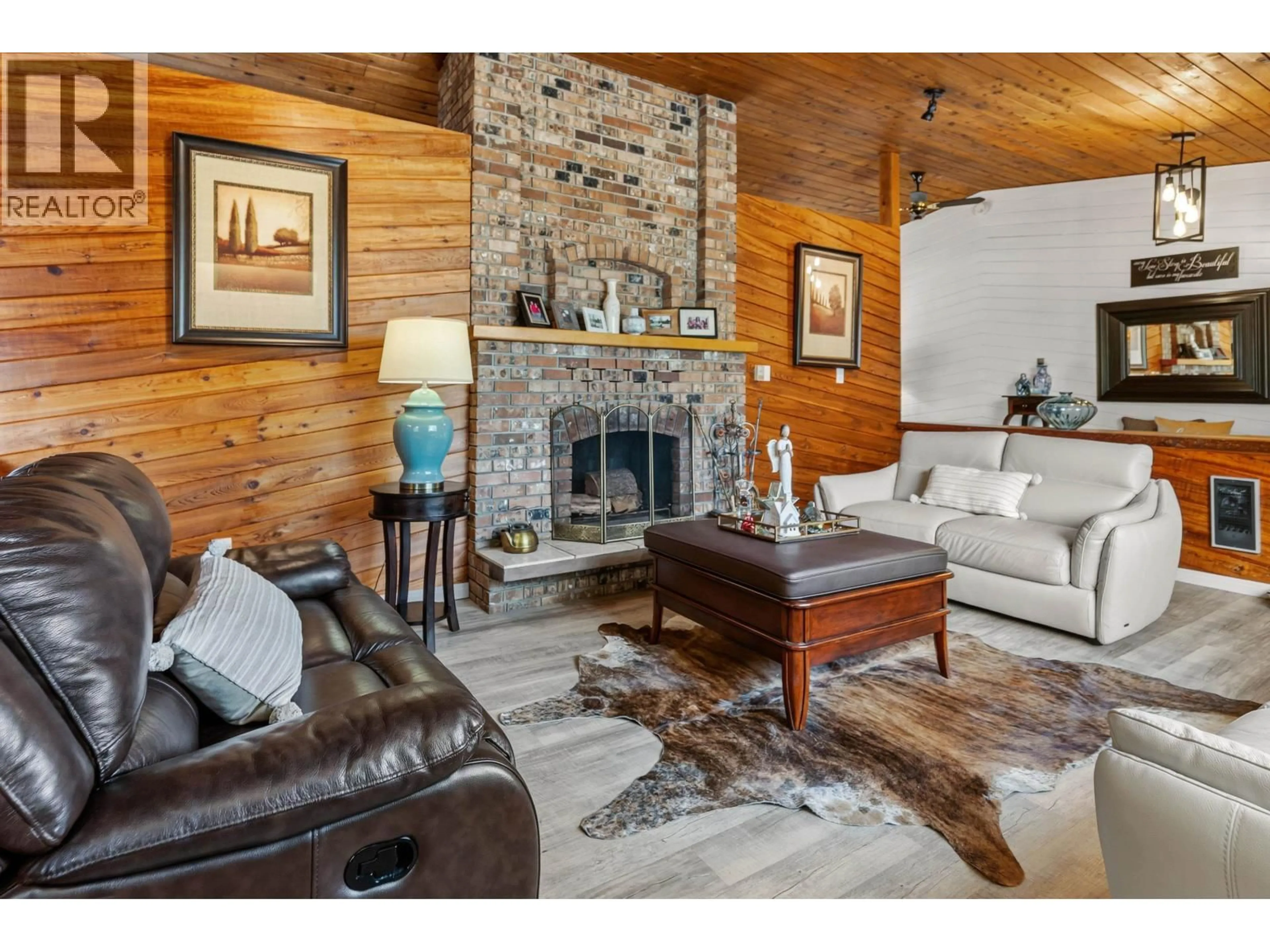Living room with furniture, wood/laminate floor for 5455 COURVAL ROAD, Prince George British Columbia V2N6A4