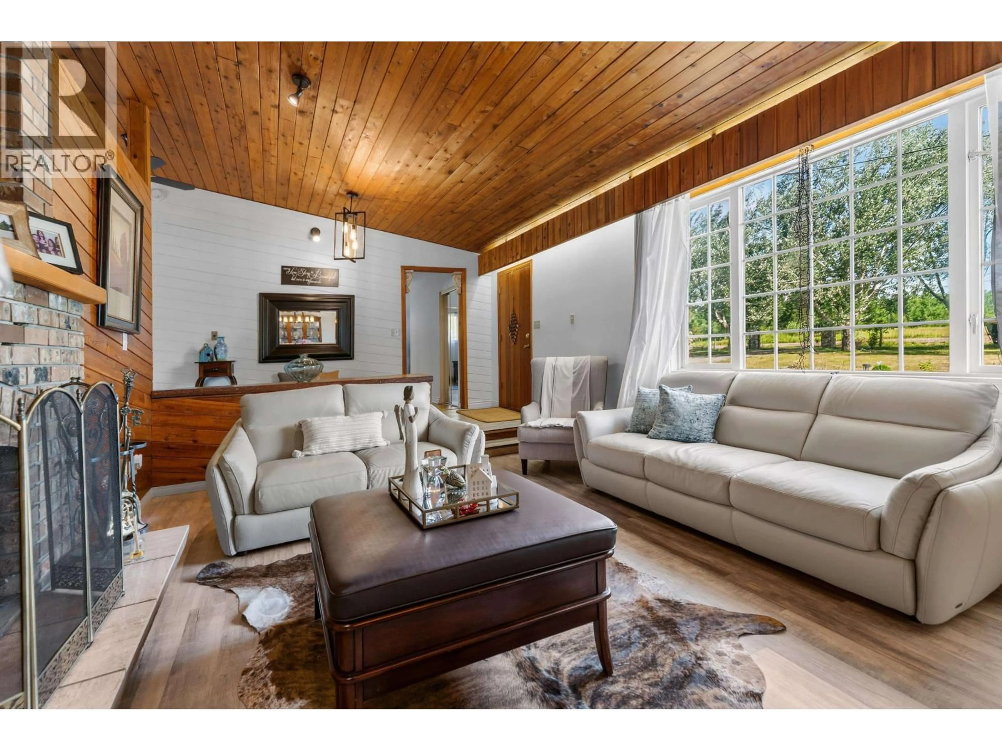 Living room with furniture, wood/laminate floor for 5455 COURVAL ROAD, Prince George British Columbia V2N6A4