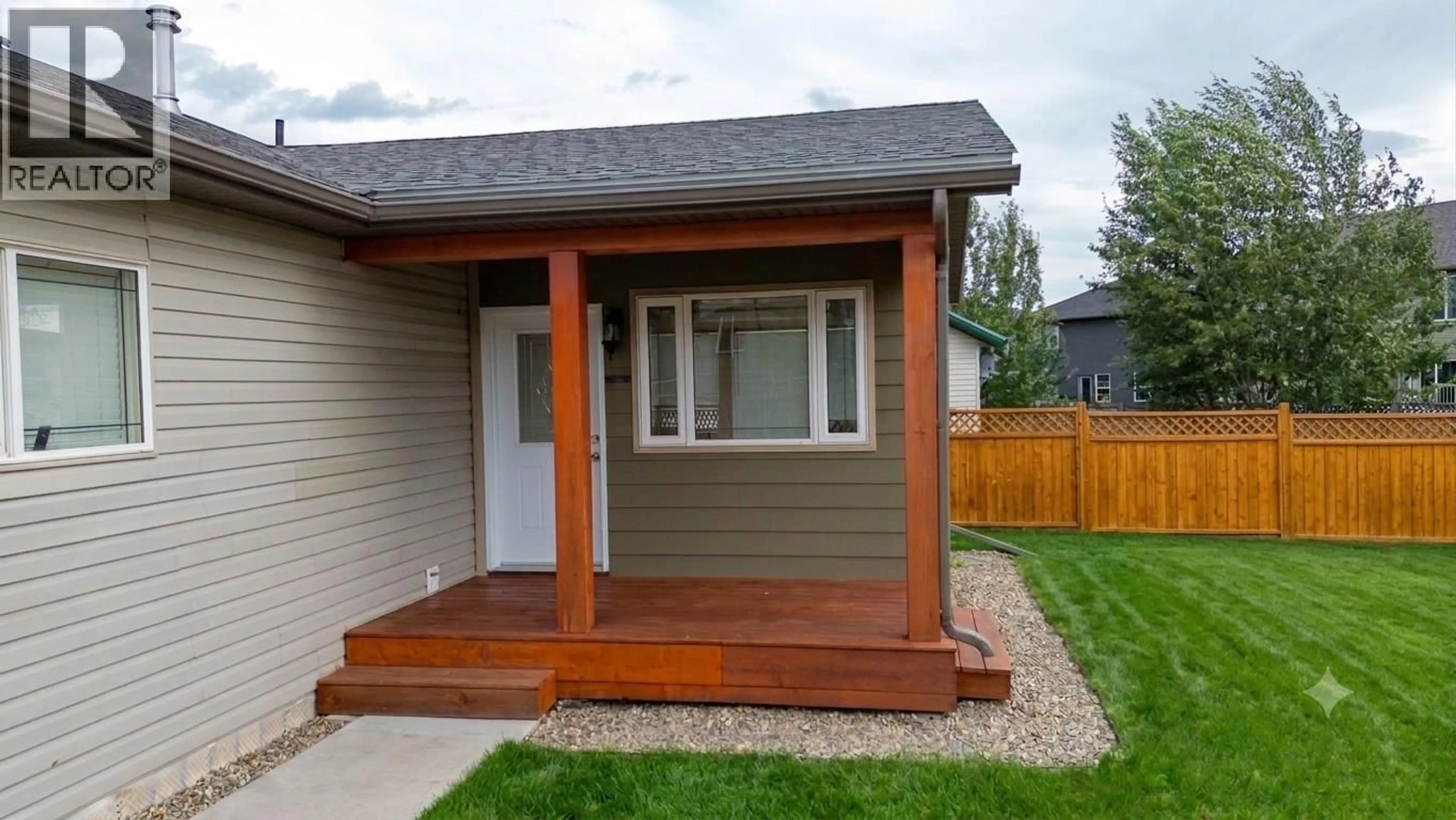 Home with vinyl exterior material, street for 8724 81A STREET, Fort St. John British Columbia V1J7H1