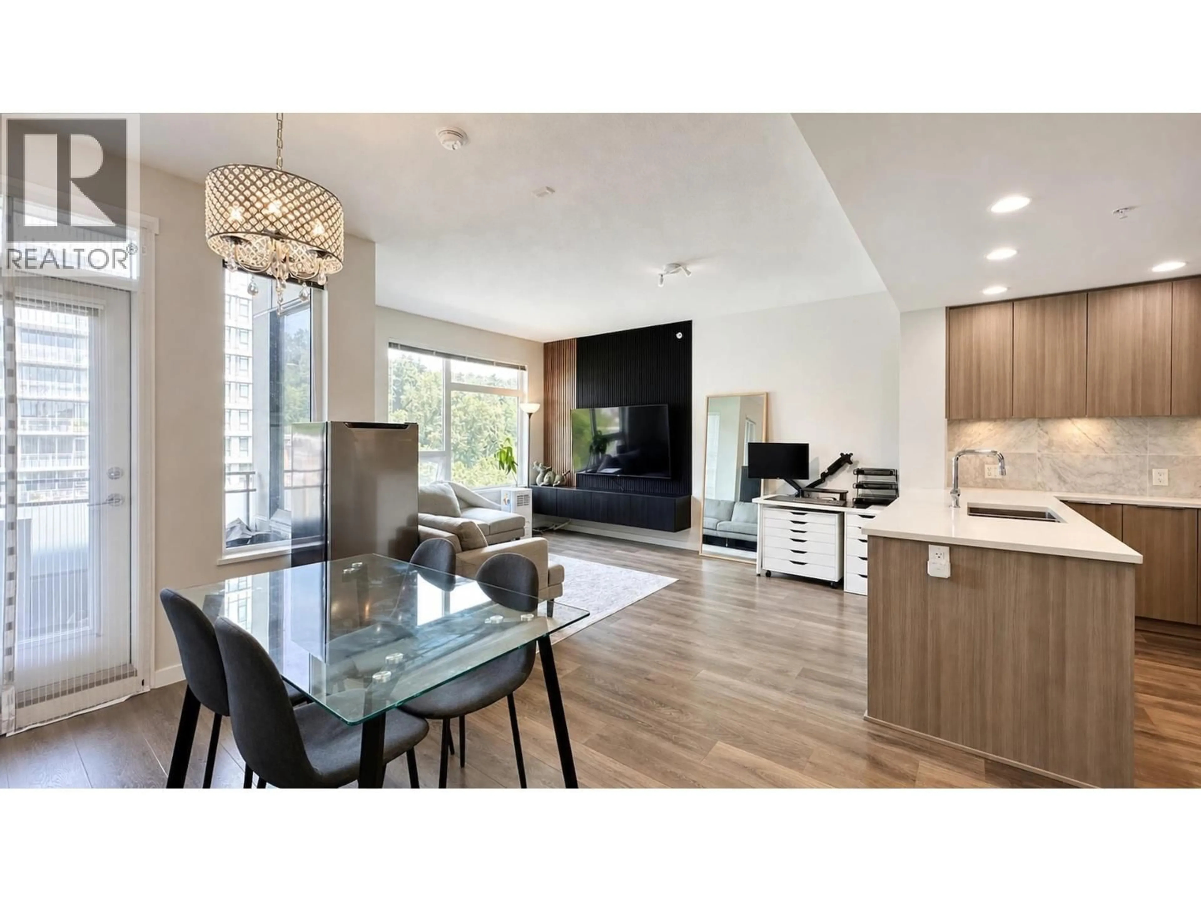 Open concept kitchen, wood/laminate floor for 610 - 3289 RIVERWALK AVENUE, Vancouver British Columbia V5S0G2