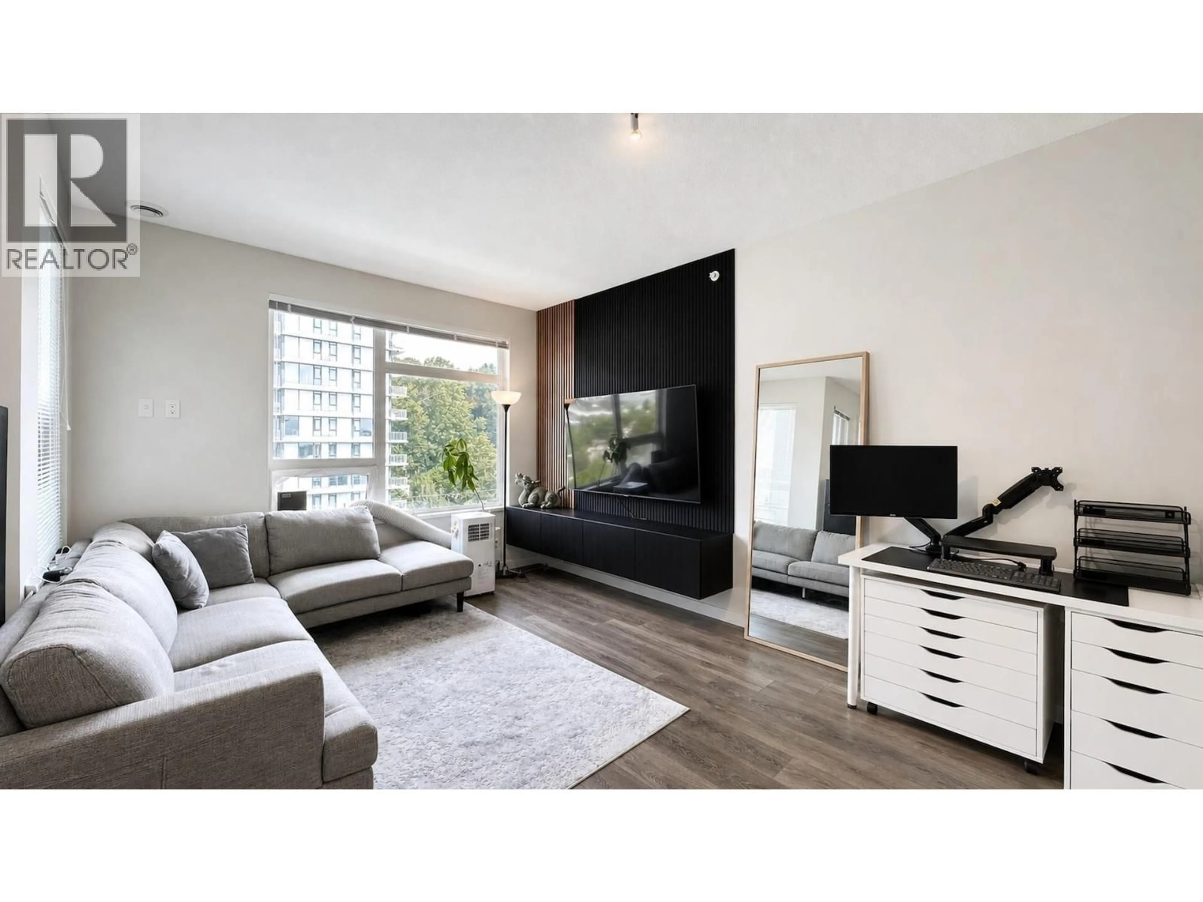 Living room with furniture, wood/laminate floor for 610 - 3289 RIVERWALK AVENUE, Vancouver British Columbia V5S0G2