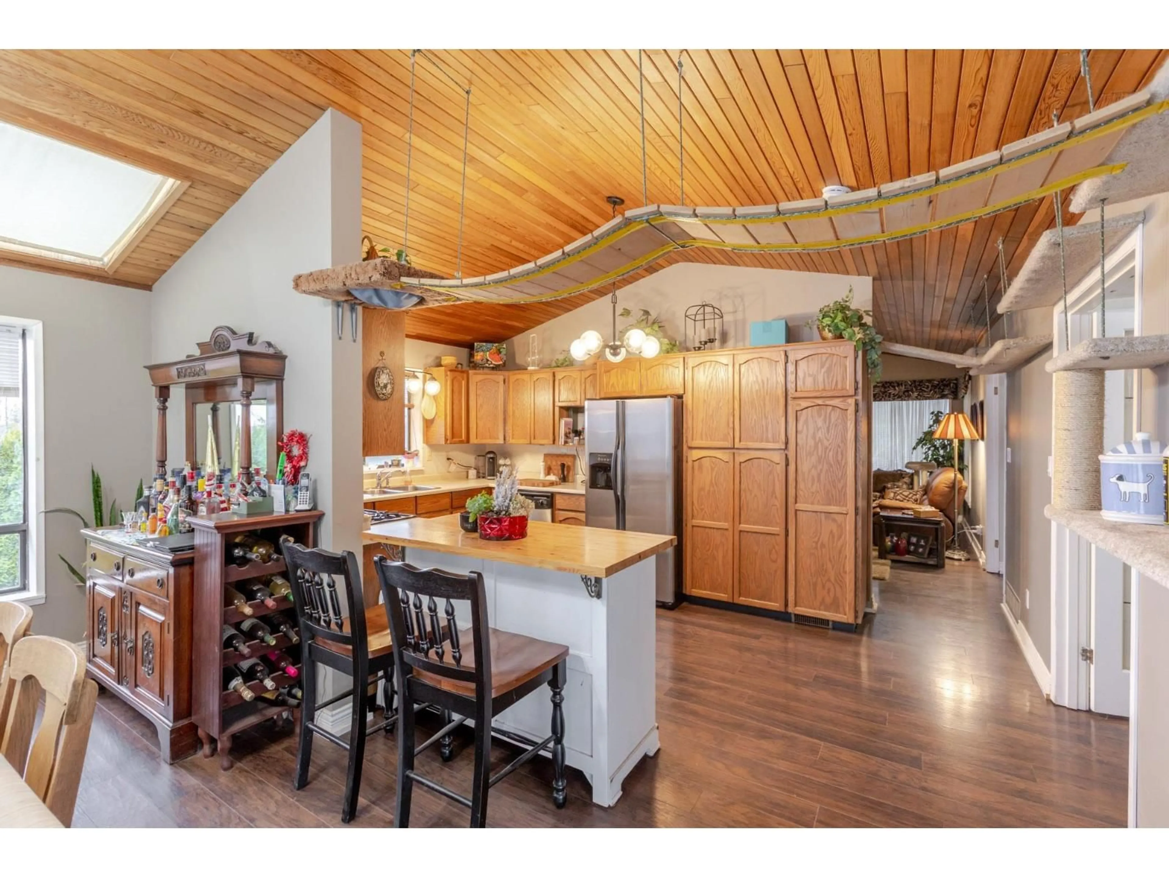 Open concept kitchen, wood/laminate floor for 7262 209A STREET, Langley British Columbia V2Y2E4